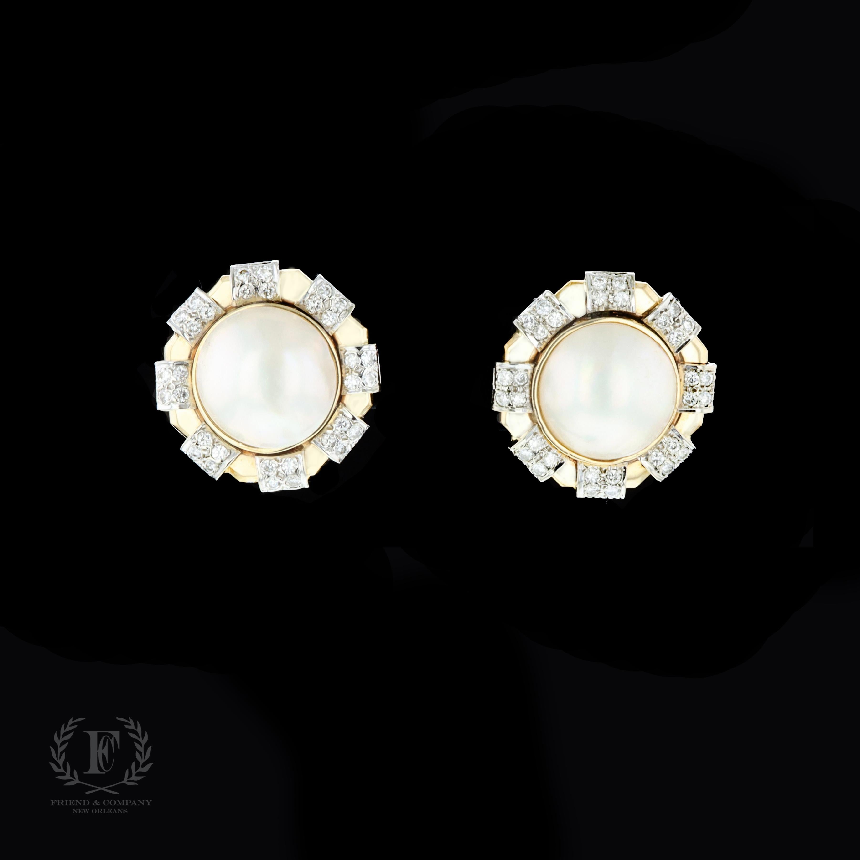 A classic and sophisticated pair of 14 karat yellow gold pearl and diamond earrings. The earrings feature 2 round cream Mabe pearls measuring 16 millimeters each. 64 round cut diamonds sparkle in this spectacular pair of earrings.