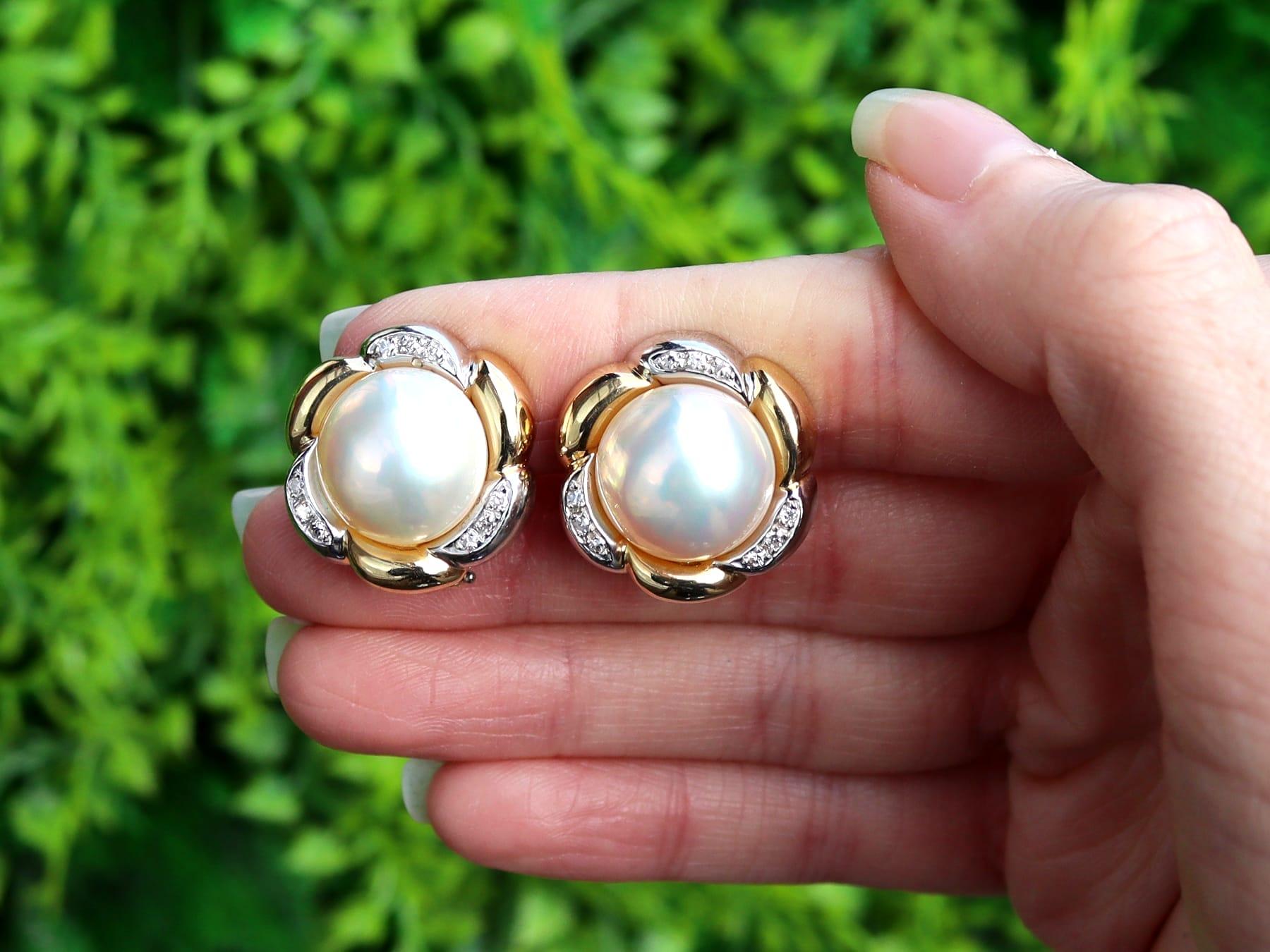 An impressive pair of vintage mabe pearl and 0.18 carat diamond, 18 karat yellow and white gold earrings; part of our diverse pearl jewelry and estate jewelry collections.

These fine and impressive vintage pearl earrings have been crafted in 18k