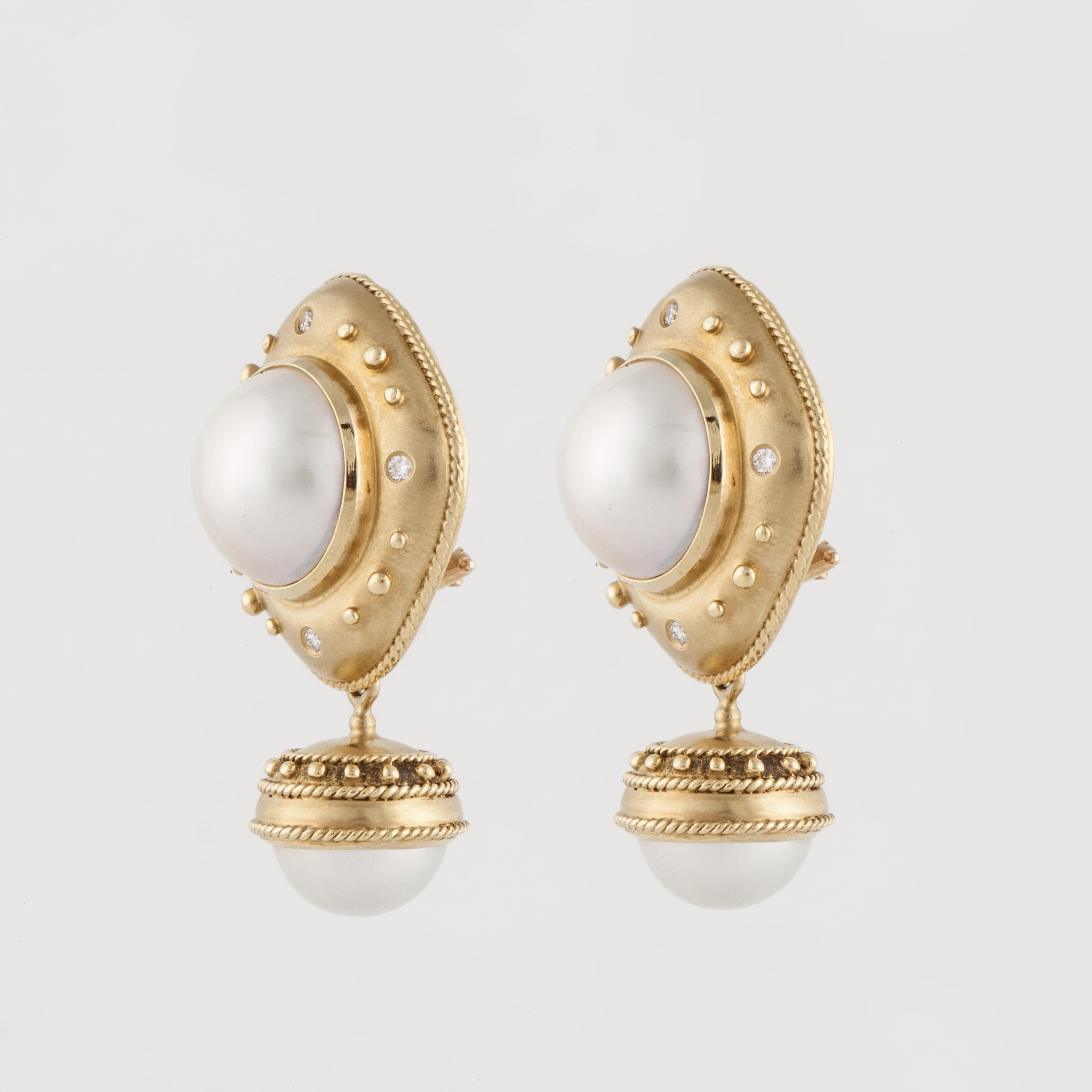 Earrings in 18K yellow brushed gold and feature Mabé pearls and detachable pearl dangles.   There are eight (8) round diamonds that total 0.20 carats.  These earrings are clip style but a post could easily be added.  They measure 1 1/2 inches long