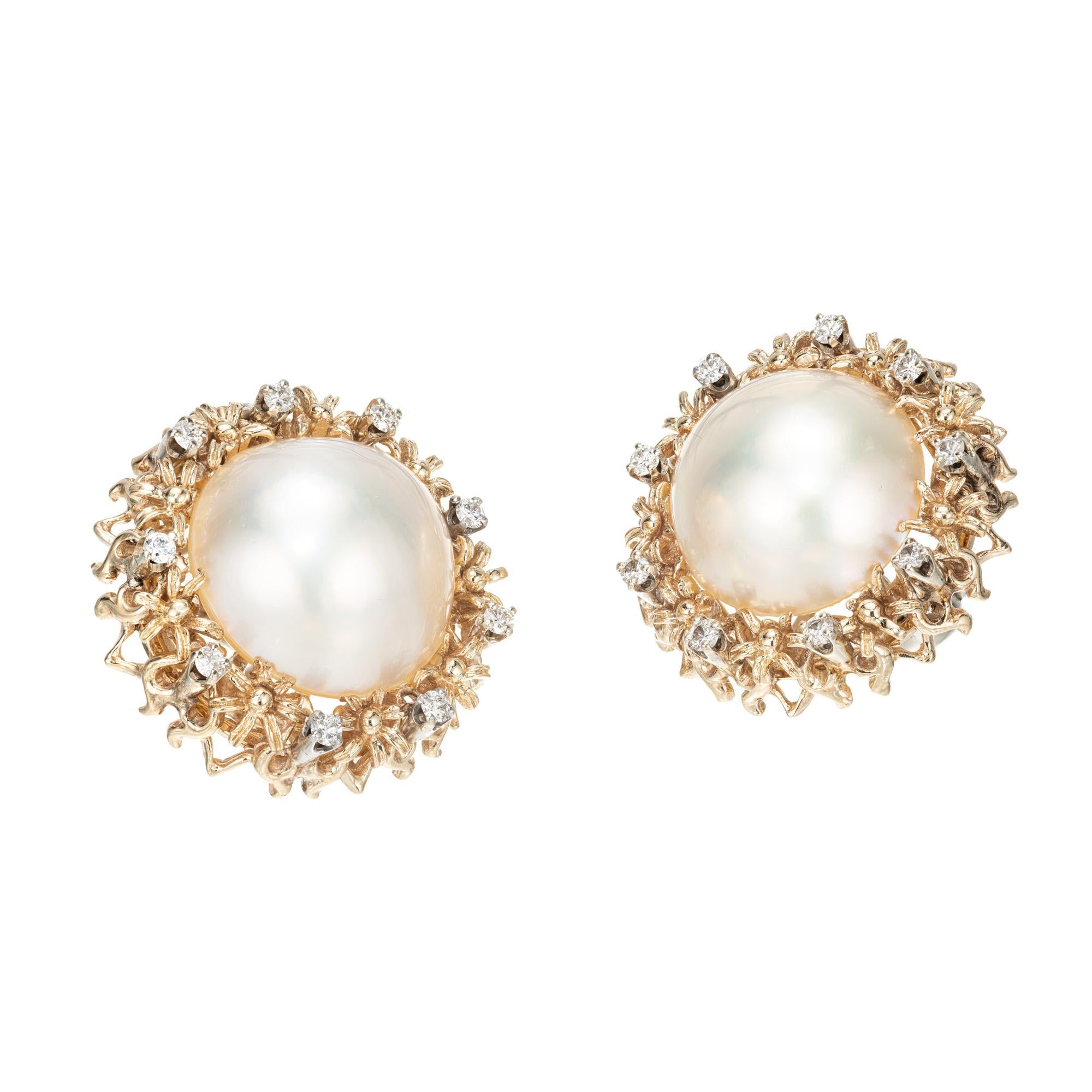 1950's High luster Mabe pearl and diamond clip post earrings. 2, 17mm pearls each with a halo of full cut diamonds in 14k yellow gold settings. 

18 full cut diamonds, G, VS, approx. total weight .55cts, G, VS2
2 17mm Mabe pearls creamy white high