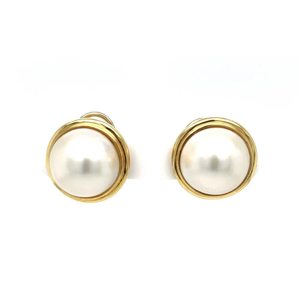 Simply Beautiful! Round Mabe Pearl Earrings set in 14K Yellow Gold rims. Each pearl, measuring approx. 15mm and 20.5mm. French Clip-on backs. More Beautiful in Real time. Sure to be admired…A piece you’ll turn to time and again!
