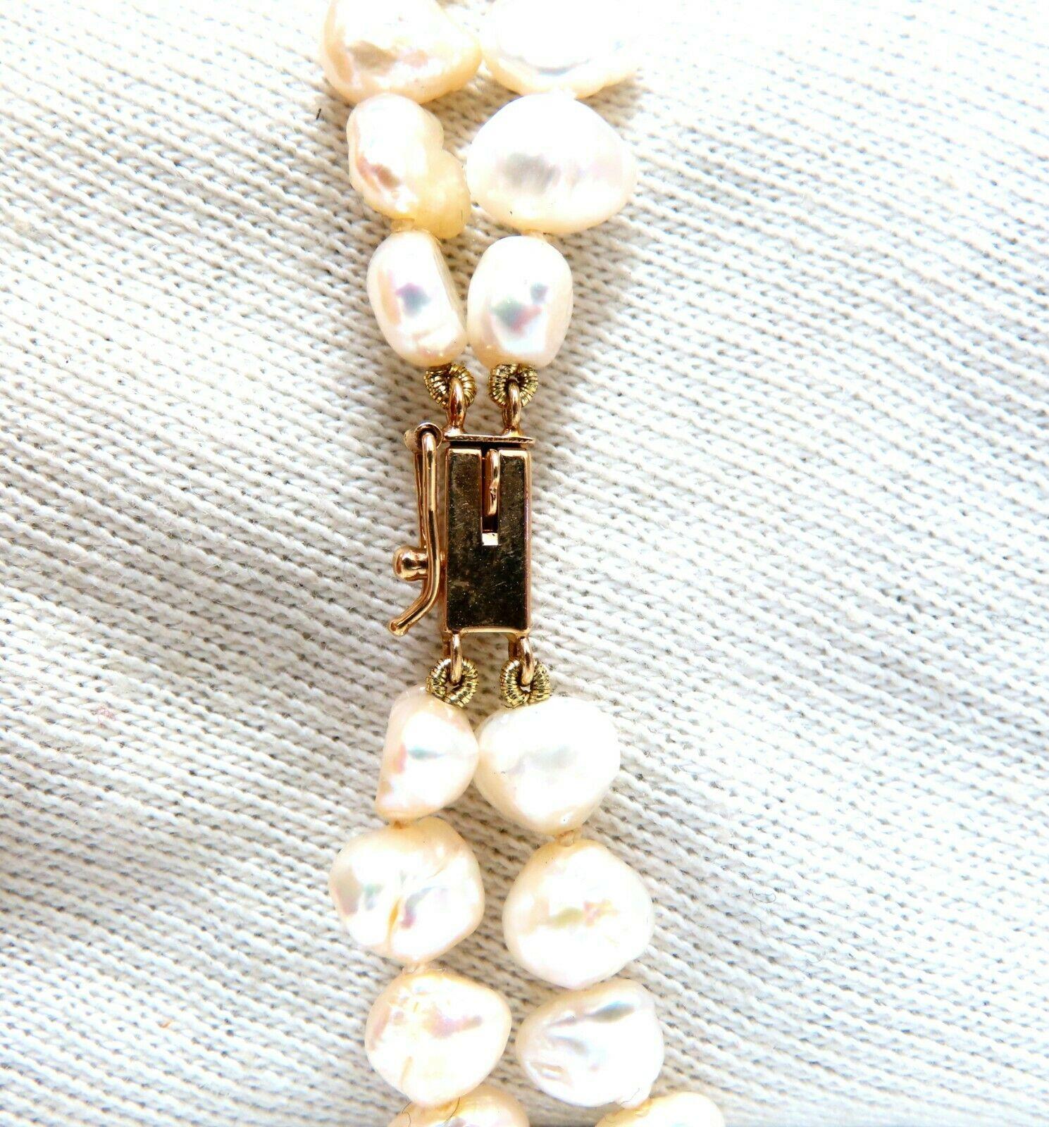 21 x 14mm Pear Shaped Mabe Pearl necklace.

Double stranded 6.5mm fresh water beads.

Center Pendant: 47 x 27mm

With 14kt. yellow gold clasp

Necklace: 16 inches long.

clasp: 7x 3mm clasp