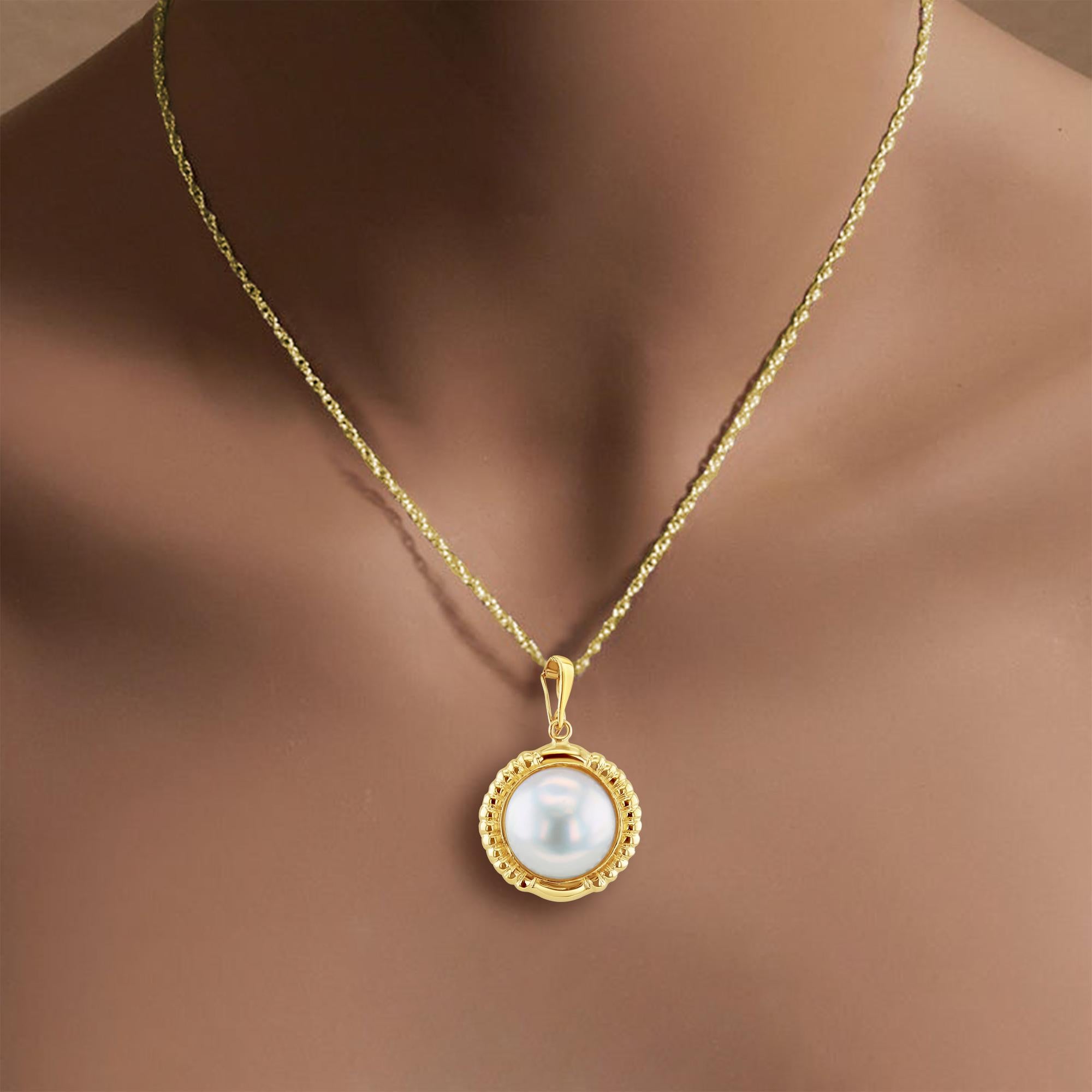 ♥ Product Summary ♥

Main Stone: Mabe Pearl
Pearl Size: 15mm
Metal: 14k Yellow Gold
Dimensions: 32mm x 21mm 
Weight: 4 grams
Enhanced Bail

Diamonds & Gemstones are Natural. Not enhanced, simulated or lab-created.

