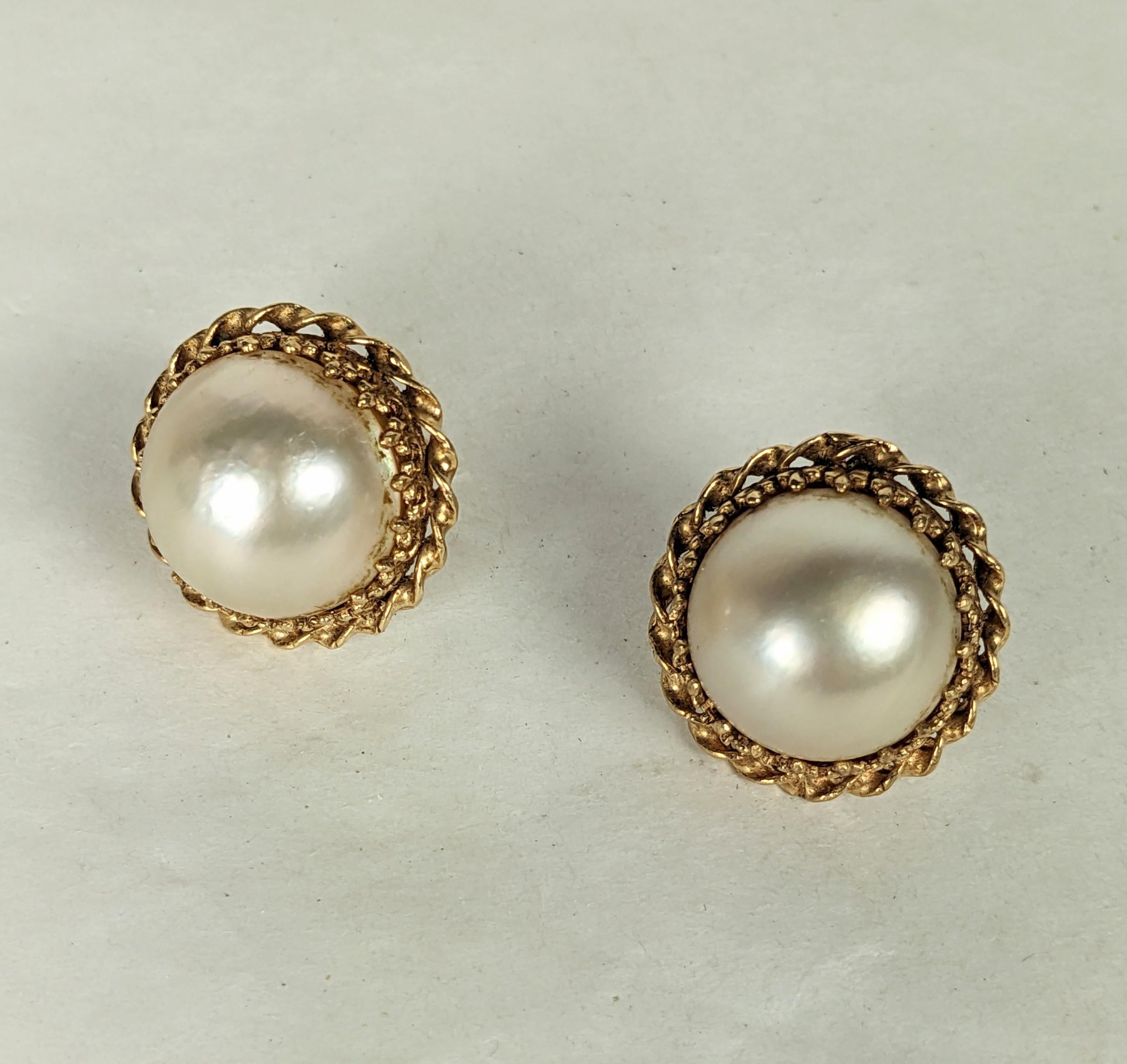 Mabe Pearl Stud Earrings from the 1960's set in 14k ornate gold twisted border. Stud fittings. .75