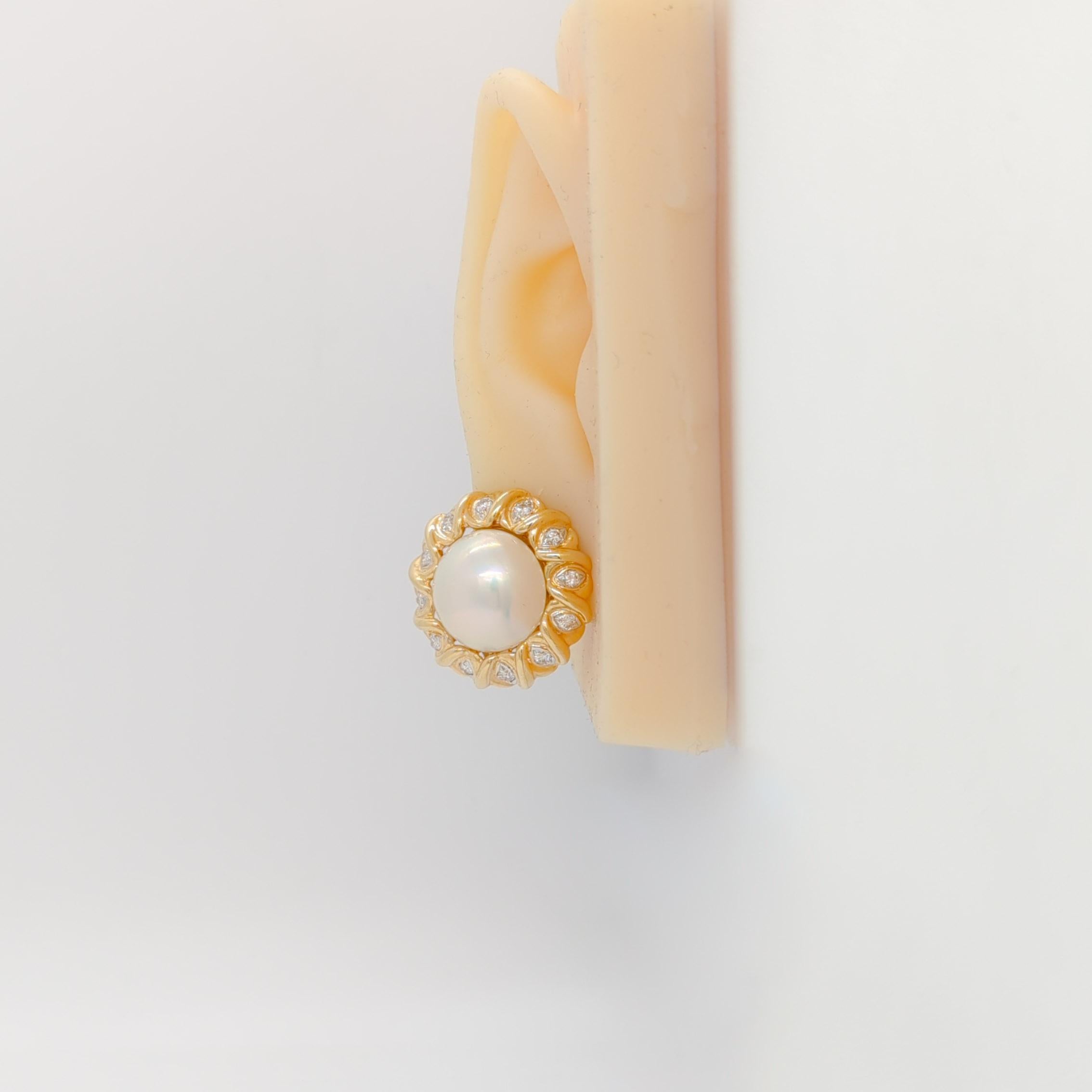 Beautiful lever back earrings with 2 round mabe pearls and 0.20 ct. good quality white diamond rounds.  Handmade in 14k yellow gold.