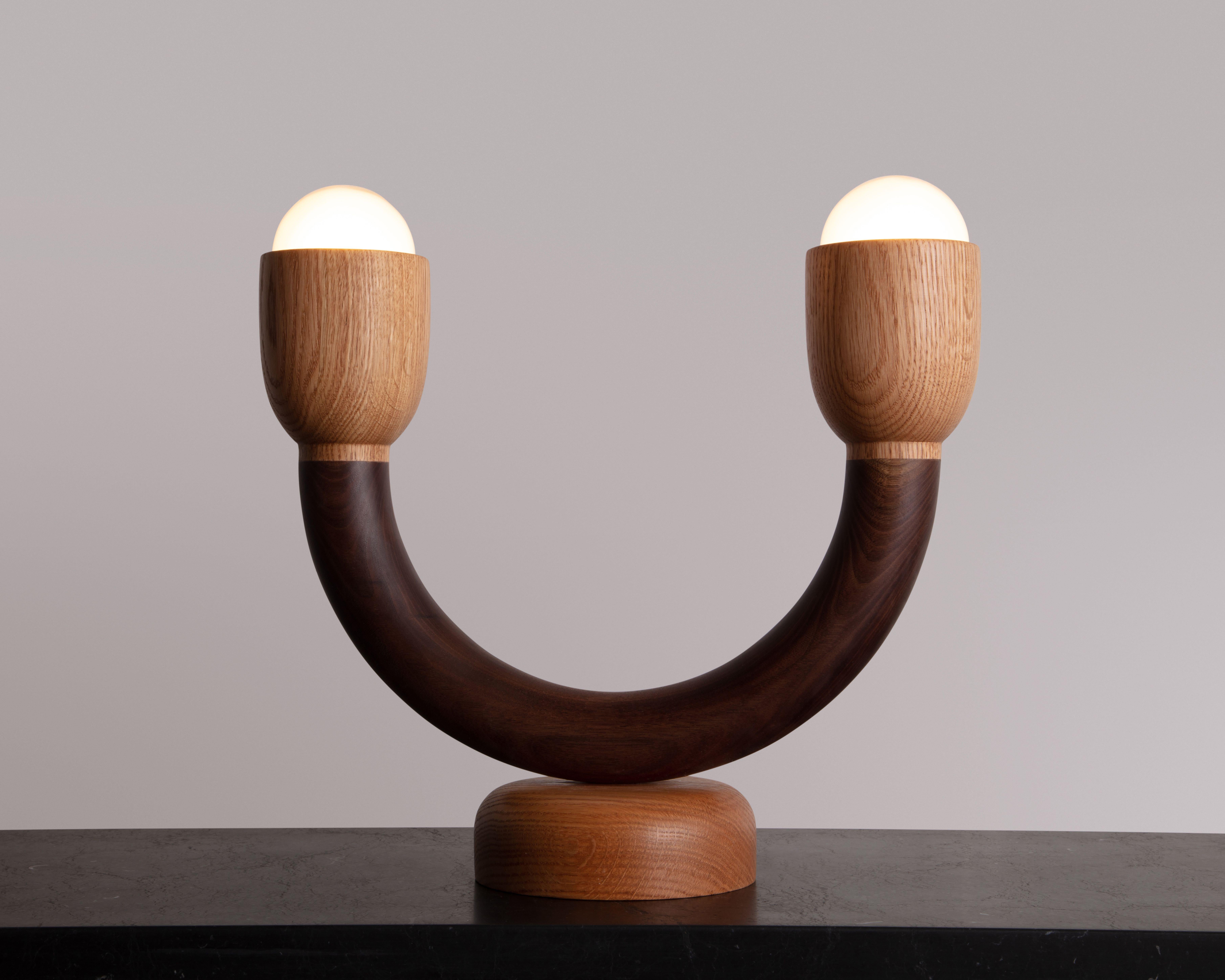 The Macaroni table light was created though an exploration of shaping solid walnut slab lumber. Designed to bring a smile to any space, each light is thoughtfully selected to highlight the grain pattern and characteristics of American black walnut.