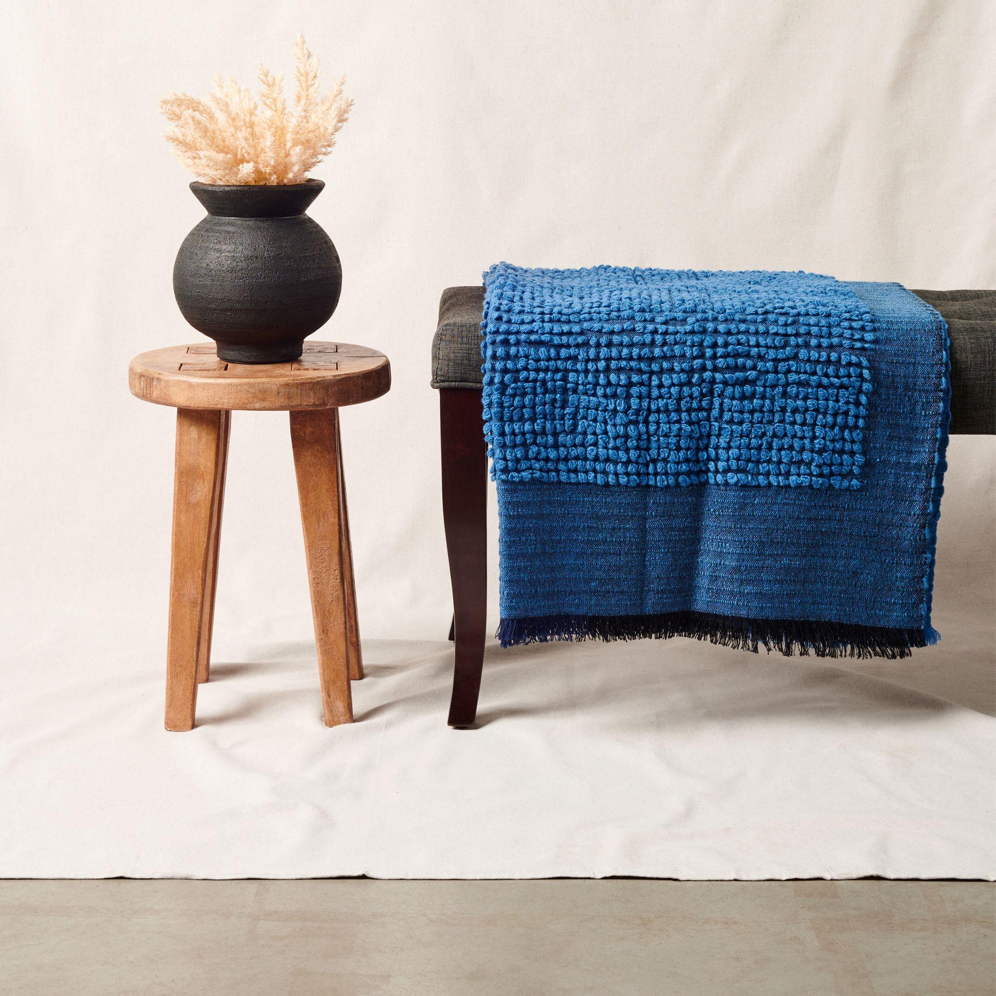 Custom design by Studio Variously, Macaroon midnight throw or blanket is a plush handloom textile ethically woven by master weavers in Nepal and dyed entirely with earth friendly dyes in soft 100% merino yarn.

A sustainable design brand based out