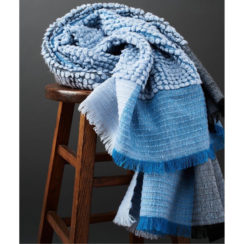 Custom design by Studio Variously, Macaroon sky throw or blanket is a plush handloom textile ethically woven by master weavers in Nepal and dyed entirely with earth friendly dyes in soft 100% merino yarn.

A sustainable design brand based out of