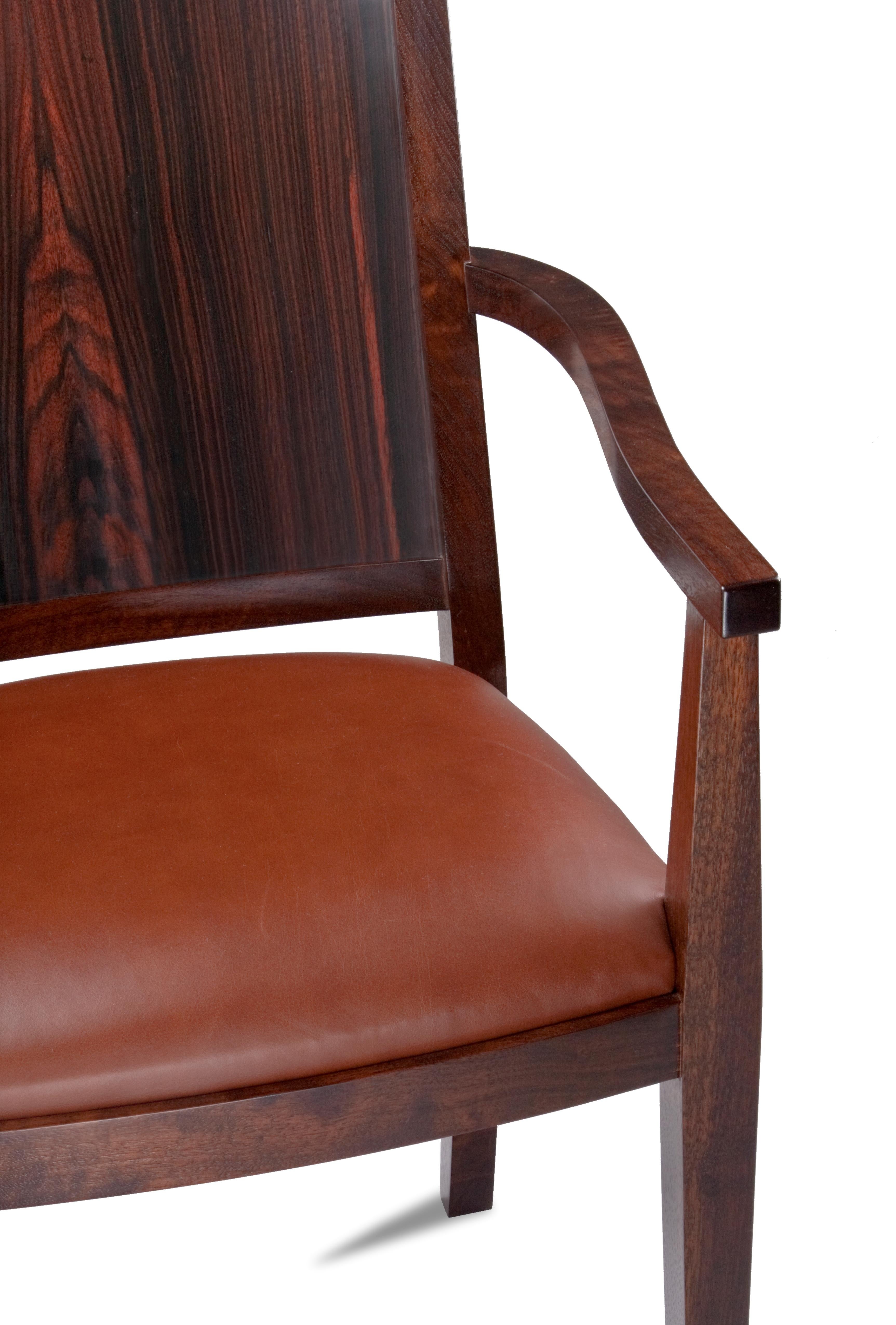 Macassar ebony and walnut dining chairs

Mortise and tenon construction with exotic wood back panel. Clean modern lines with craftsman execution. Comes in arm chair and side chair.
Arm chair $3800
Side chair $3200.
