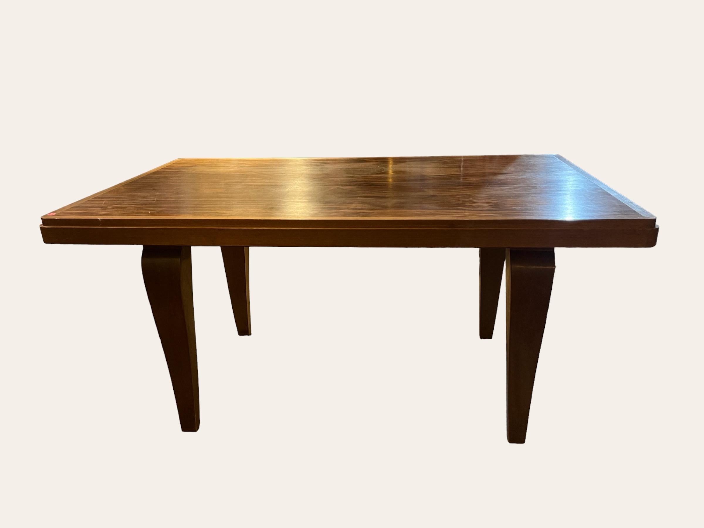 beautiful Art Deco dining table in a rare macassar ebony veneer
table attributed to Ateliers Vallin, Nancy, France 
table with two leaves of 45 centimeters each.