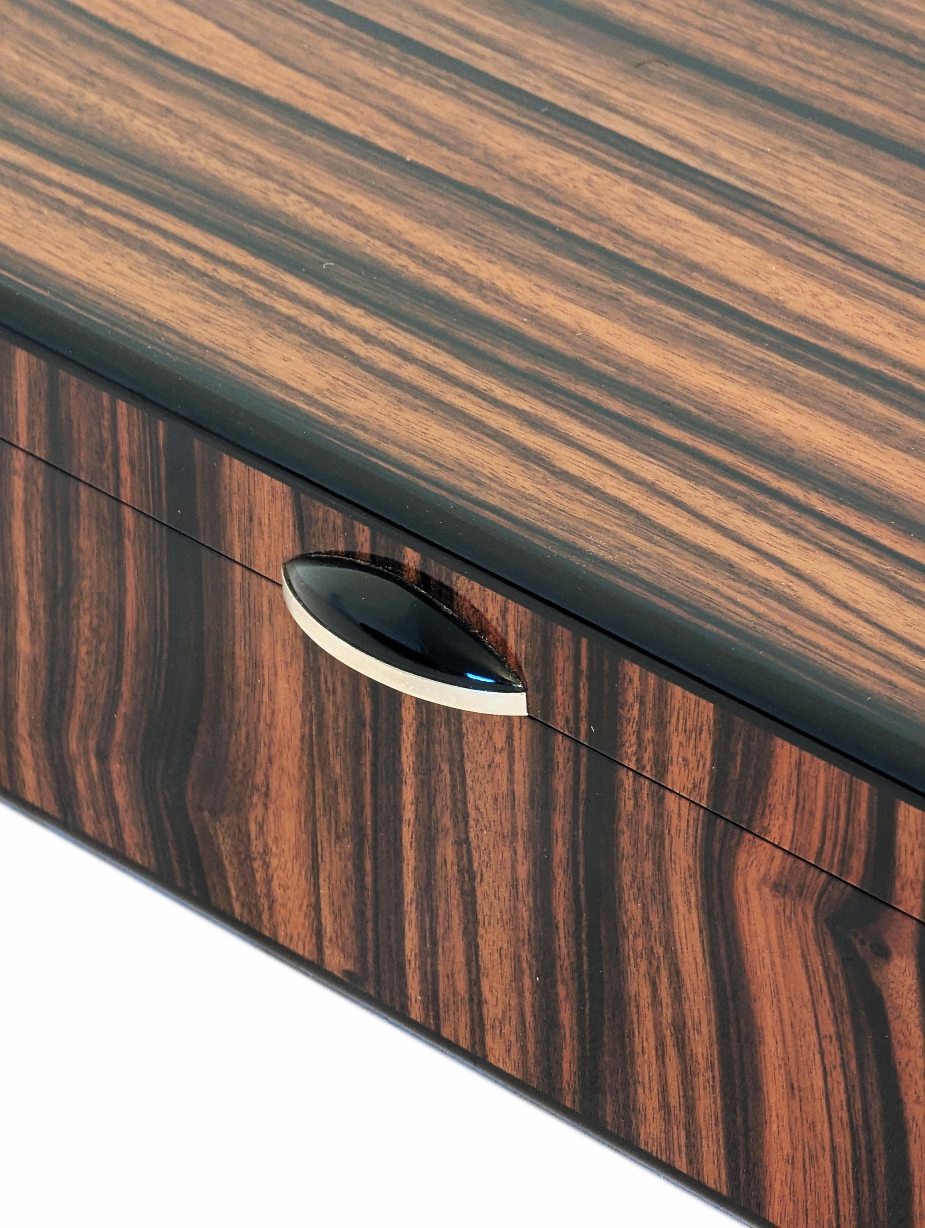 Macassar Ebony Keepsake Box
“Beautiful boxes are a passion of mine. The idea of having something truly beautiful to place special memories into has always had a strong emotional appeal to me. My mother had a special box on her dressing table, and