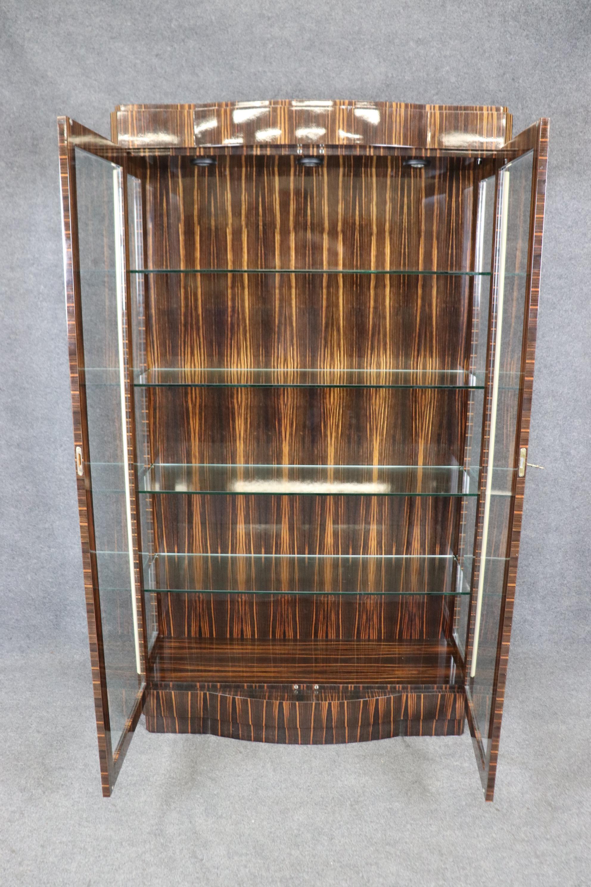 This is a fine quality replica made in the 2010s era to exactly duplicate a unbelievably expensive Ruhlmann genuine Art Deco vitrine that the owner had copied because of the expense. This is a one-of-a-kind model and the only one in the world. The