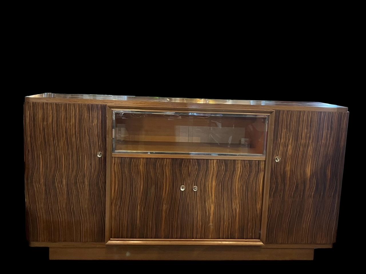 Rare sideboard of the art deco period attributed to ateliers Vallin, Nancy, France 
sideboard in rare ebony Macassar veneer and vitrine in chromed brass.