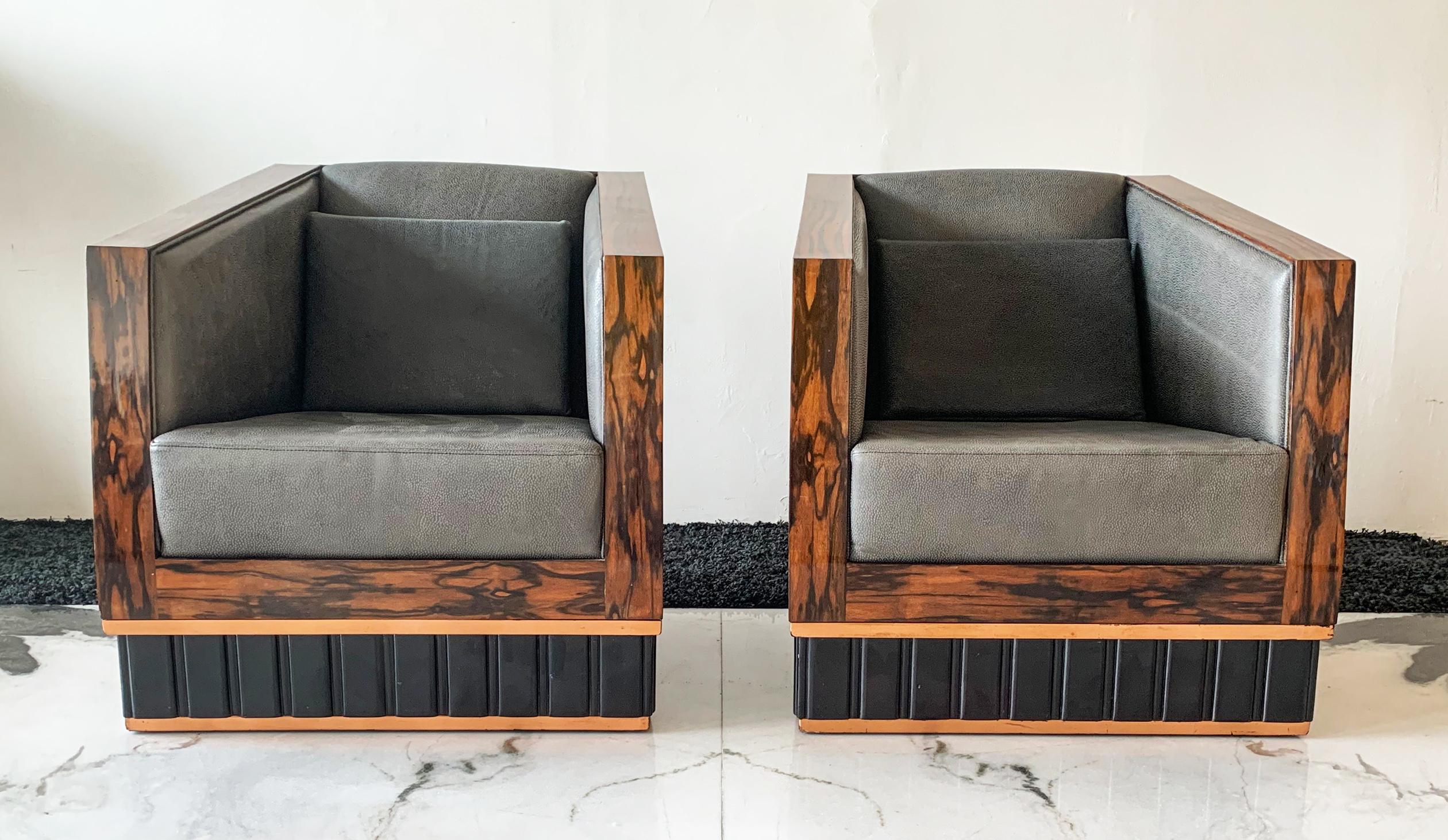 Available right now we have a matched pair of Macassar ebony wrapped club chairs, circa 1950s. These stunning chairs have a great boxy shape and are super transitional in a way that they could be incorporated into almost any Art Deco, Mid-Century