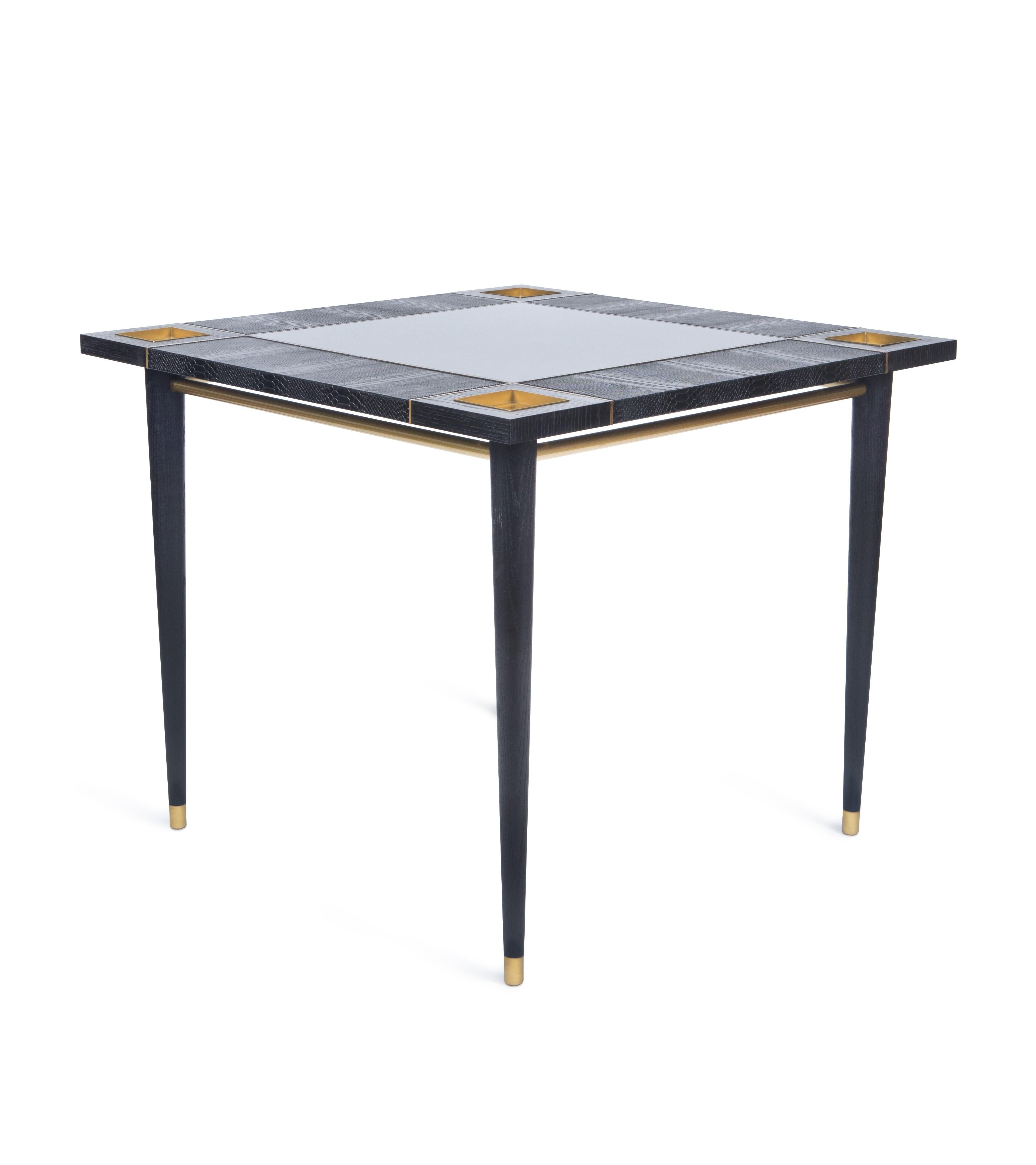 A piece that elevates the concept of ‘gaming table’ through the use of exotic luxury leather, lacquer and brass. A true statement piece that appeals to the touch and perfectly embodies the rich game of contrast and textures.

The price doesn't