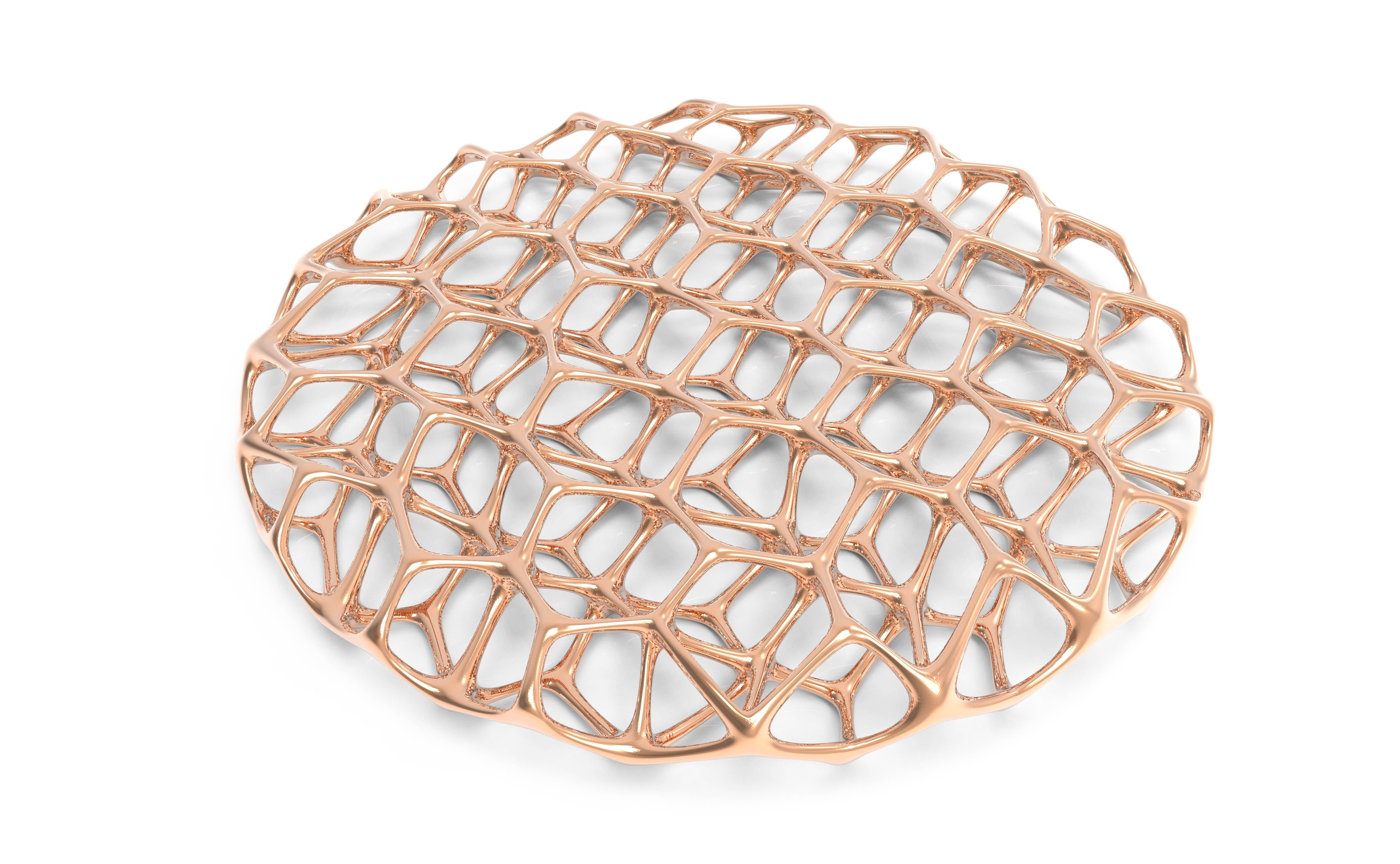 A signature Kyttanen design that has been integrated into the permanent collection at MoMA. This piece measures 50cm in diameter, and is inspired by structures formed by soap bubbles. Available in luxurious glossy rose gold and silver-plated