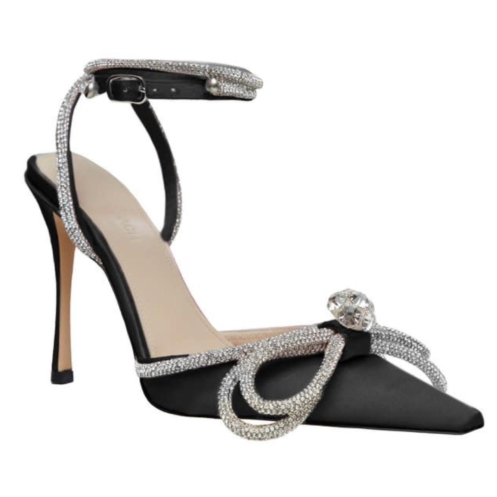 Mach & Mach's Double Bow pumps are a brand signature. This iteration is made from satin and embellished with a crystal-encrusted silver rope that wraps around the ankles and pointed vamp. The pumps future an ankle strap with buckle fastening and a