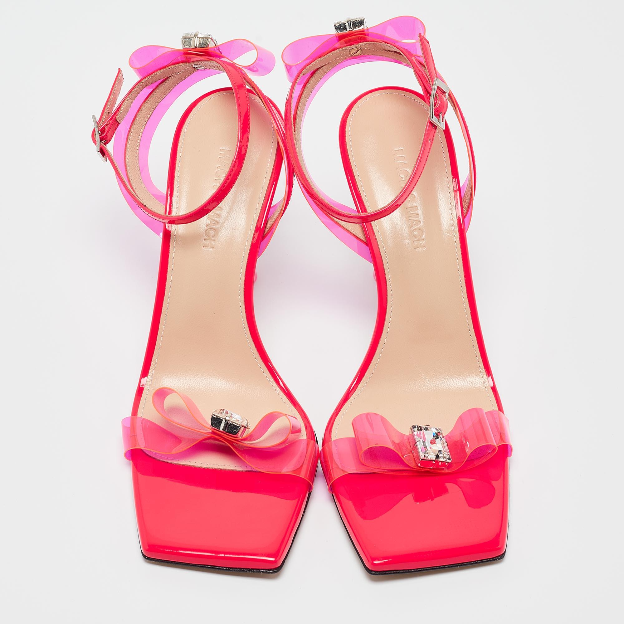 Slip into the epitome of playful luxury with Mach & Mach's sandals. Crafted with meticulous attention to detail, these sandals feature a charming French bow accent, blending the allure of patent leather with the whimsical appeal of translucent PVC