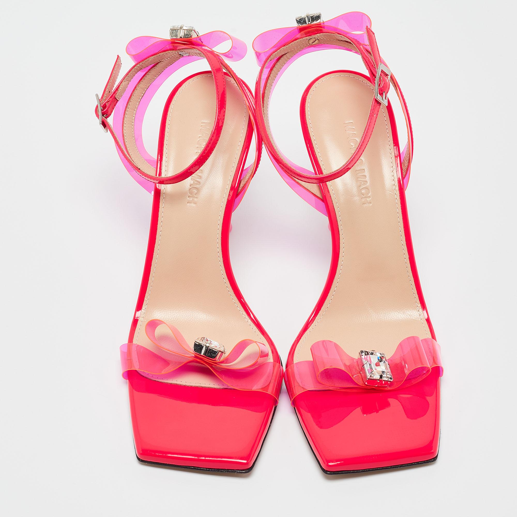 Slip into the epitome of playful luxury with Mach & Mach's sandals. Crafted with meticulous attention to detail, these sandals feature a charming French bow accent, blending the allure of patent leather with the whimsical appeal of translucent PVC