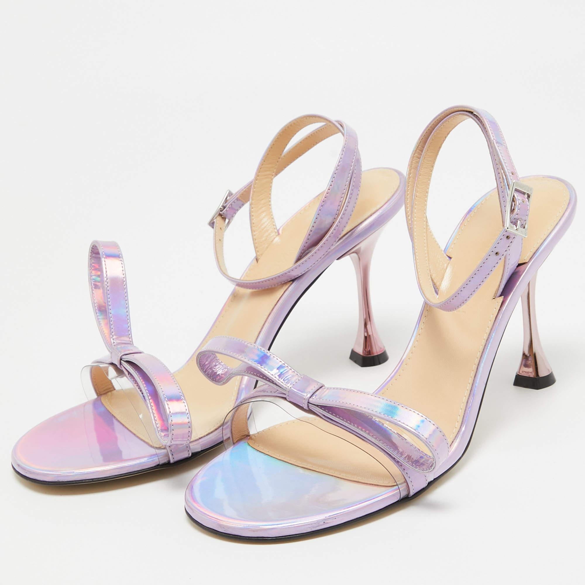 Slip into the epitome of playful luxury with Mach and Machs sandals. Crafted with meticulous attention to detail these sandals feature a charming French bow accent they are crafted using iridescent leather for a captivating statement making look.