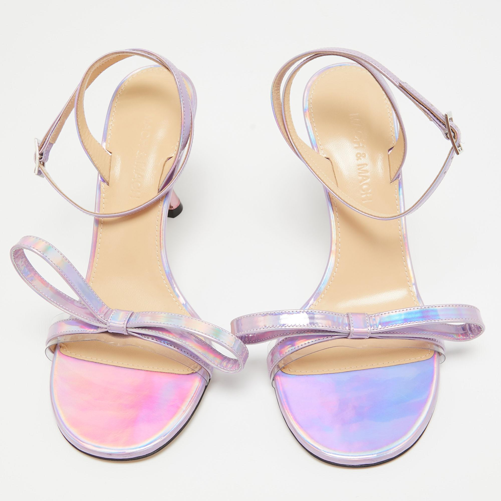 Slip into the epitome of playful luxury with Mach & Mach's sandals. Crafted with meticulous attention to detail, these sandals feature a charming French bow accent, they are crafted using iridescent leather for a captivating, statement-making