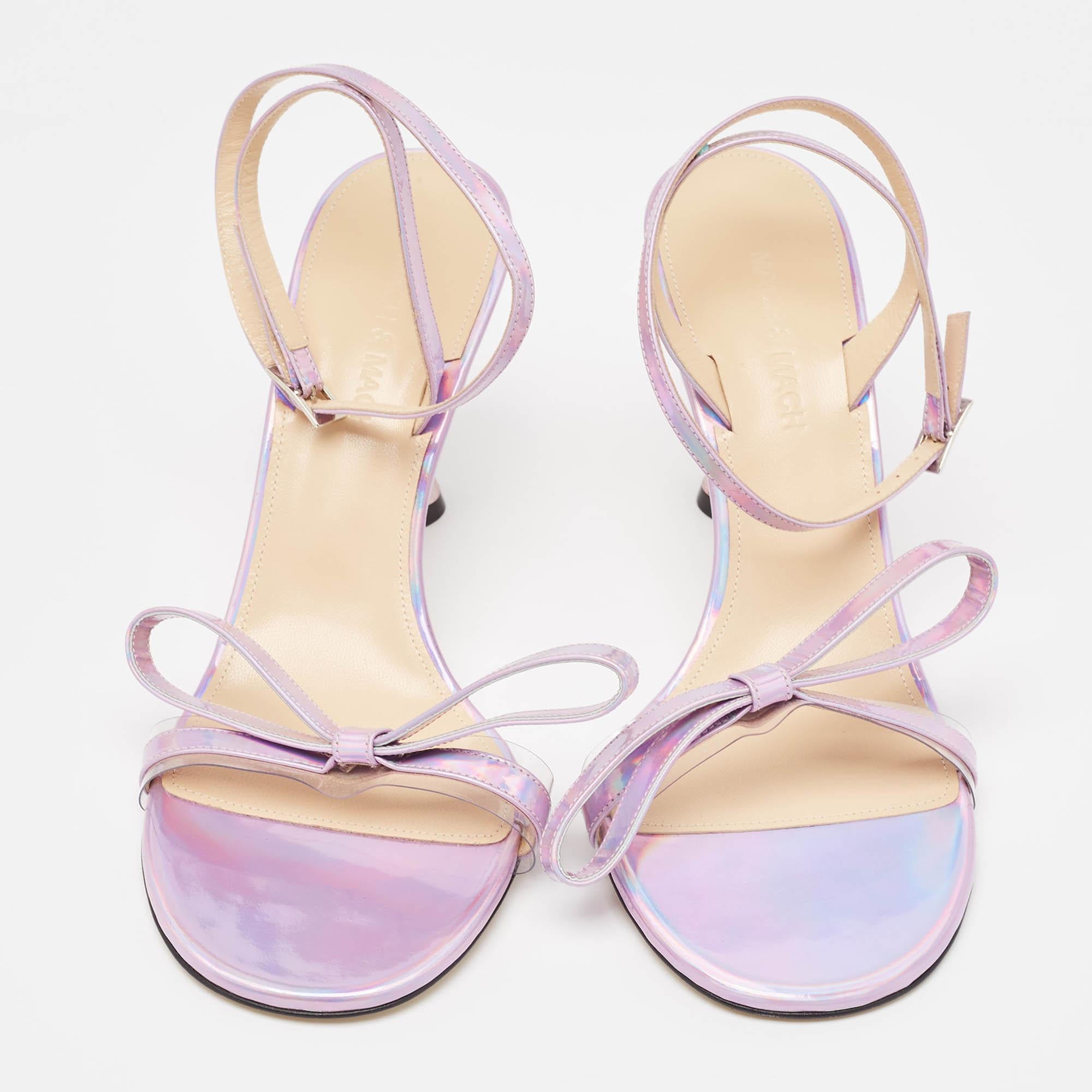 Slip into the epitome of playful luxury with Mach & Mach's sandals. Crafted with meticulous attention to detail, these sandals feature a charming French bow accent, they are crafted using iridescent leather for a captivating, statement-making