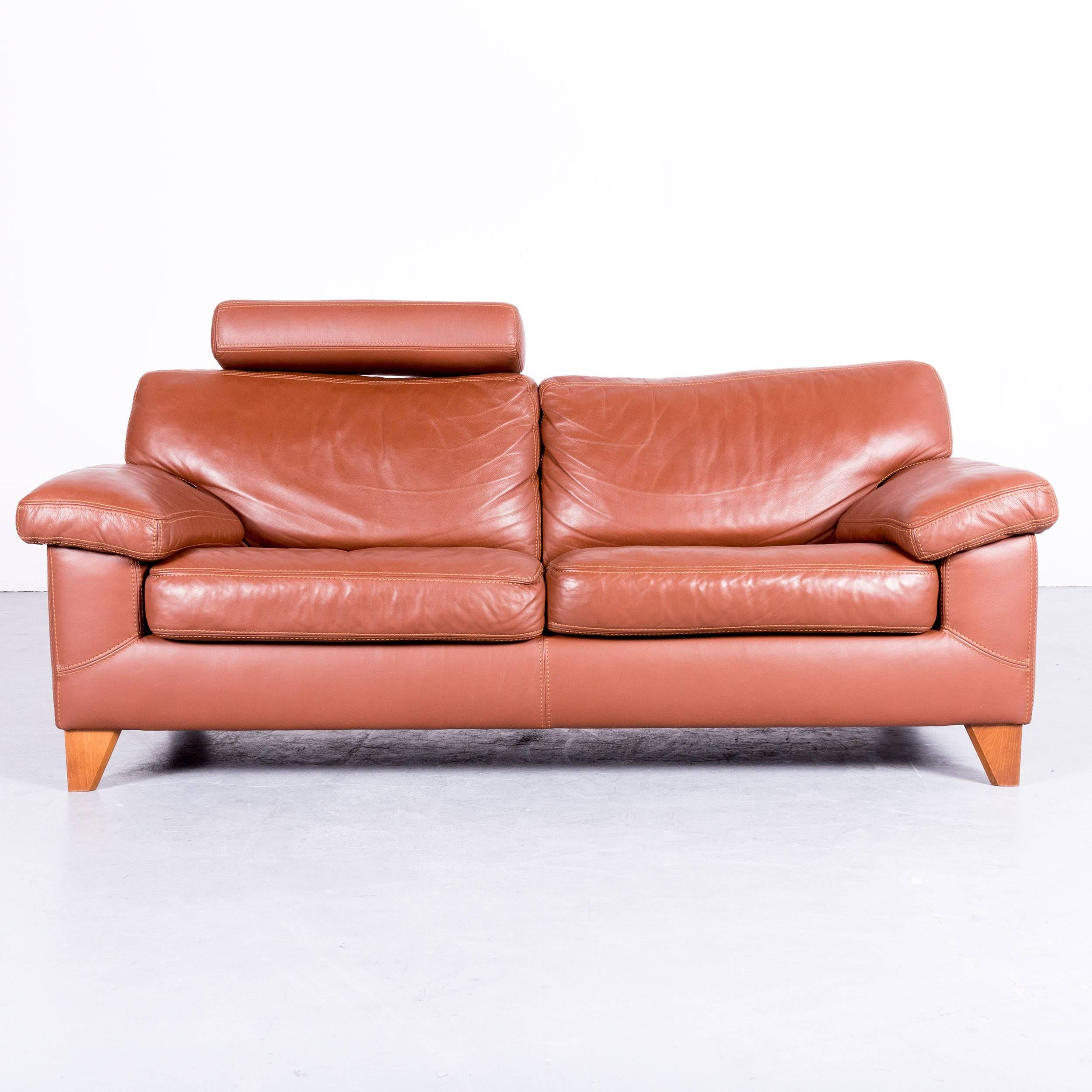 Brown colored original Machalke designer leather sofa with neck rest, in a minimalistic and modern design, made for pure comfort and flexibility.