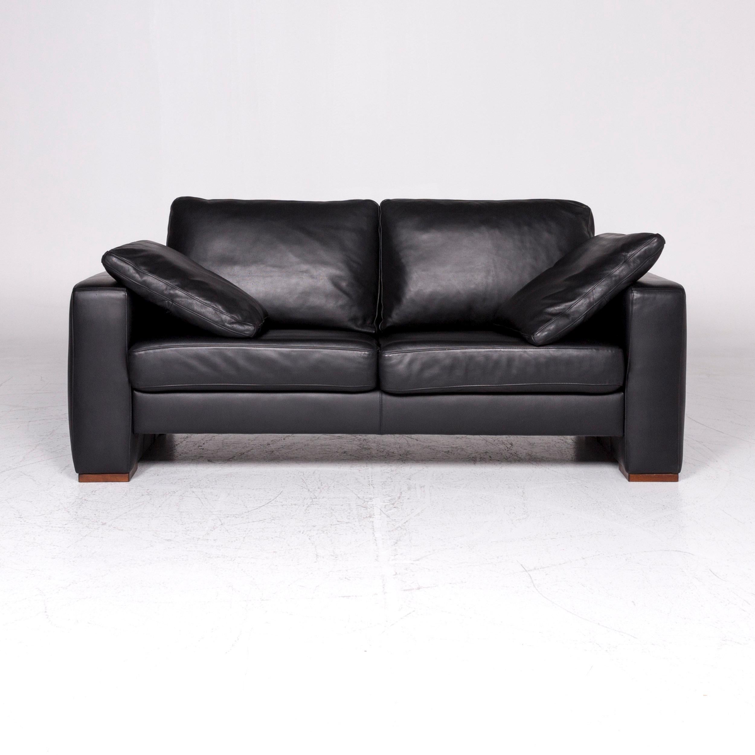 We bring to you a Machalke designer leather sofa black two-seat couch.

 Product measurements in centimeters:
 
Depth: 89
Width: 186
Height: 77
Seat-height: 43
Rest-height: 60
Seat-depth: 50
Seat-width: 145
Back-height: 36.

 