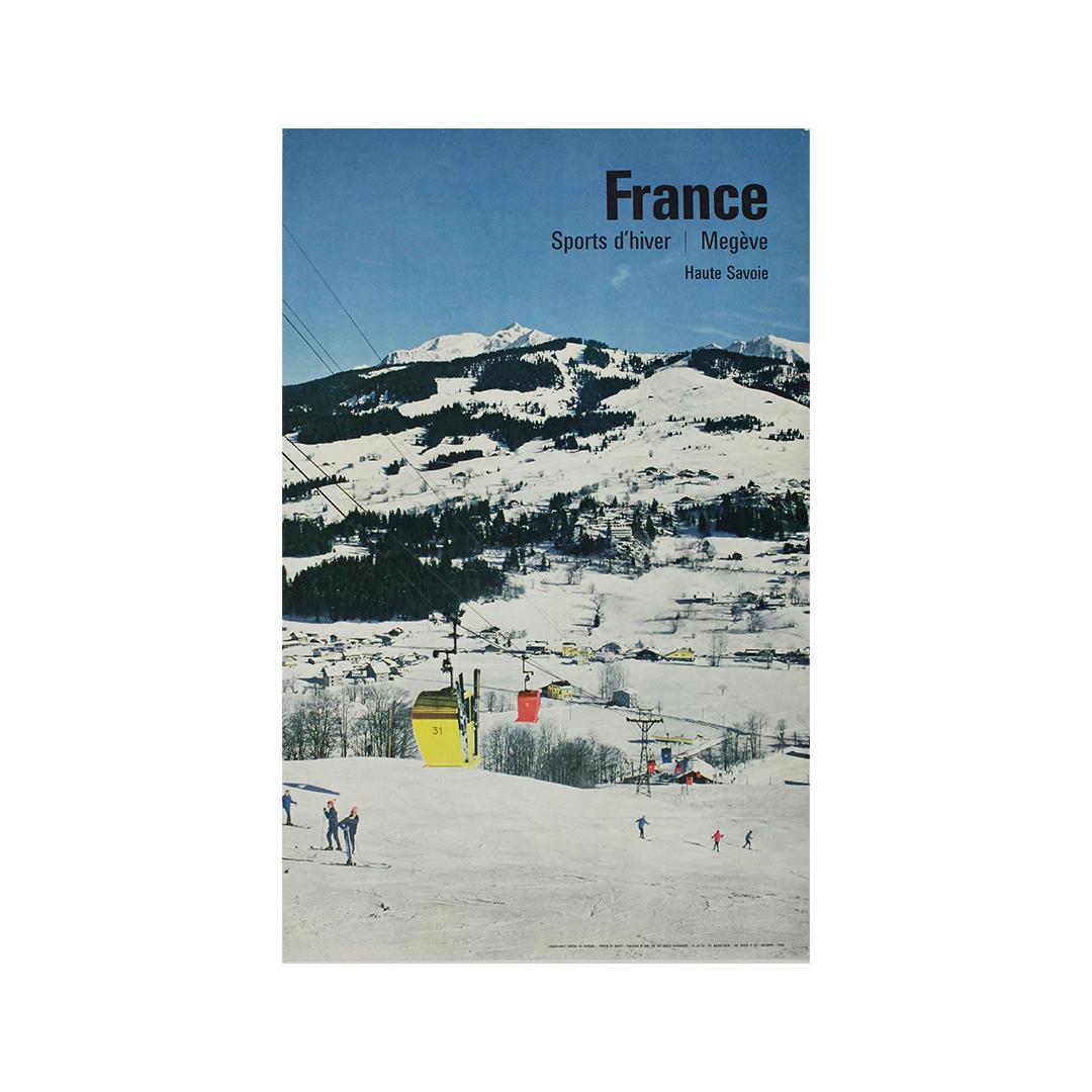 In this elegant 1964 winter travel poster, Austrian-born photographer and designer Karl Machatschek captures the idyllic charm of Megève, a storied ski resort nestled in France’s Haute-Savoie region. The image, composed with crisp photographic