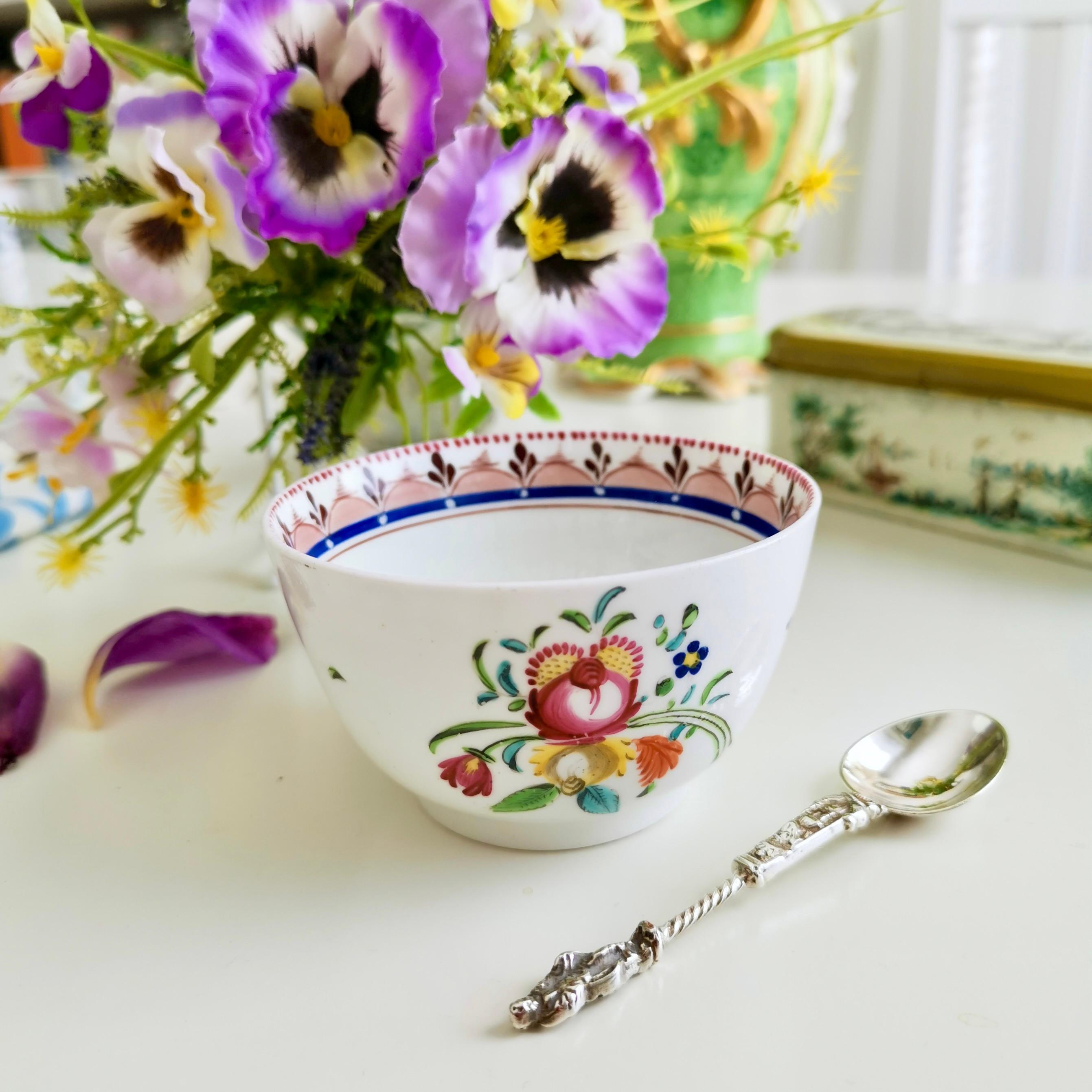 This is a charming orphaned tea bowl made by Machin between 1812 and 1815. The bowl is made of very white porcelain, has hand painted flowers and a very striking band on the inside of the rim.

Machin & Co was one of the many potteries in