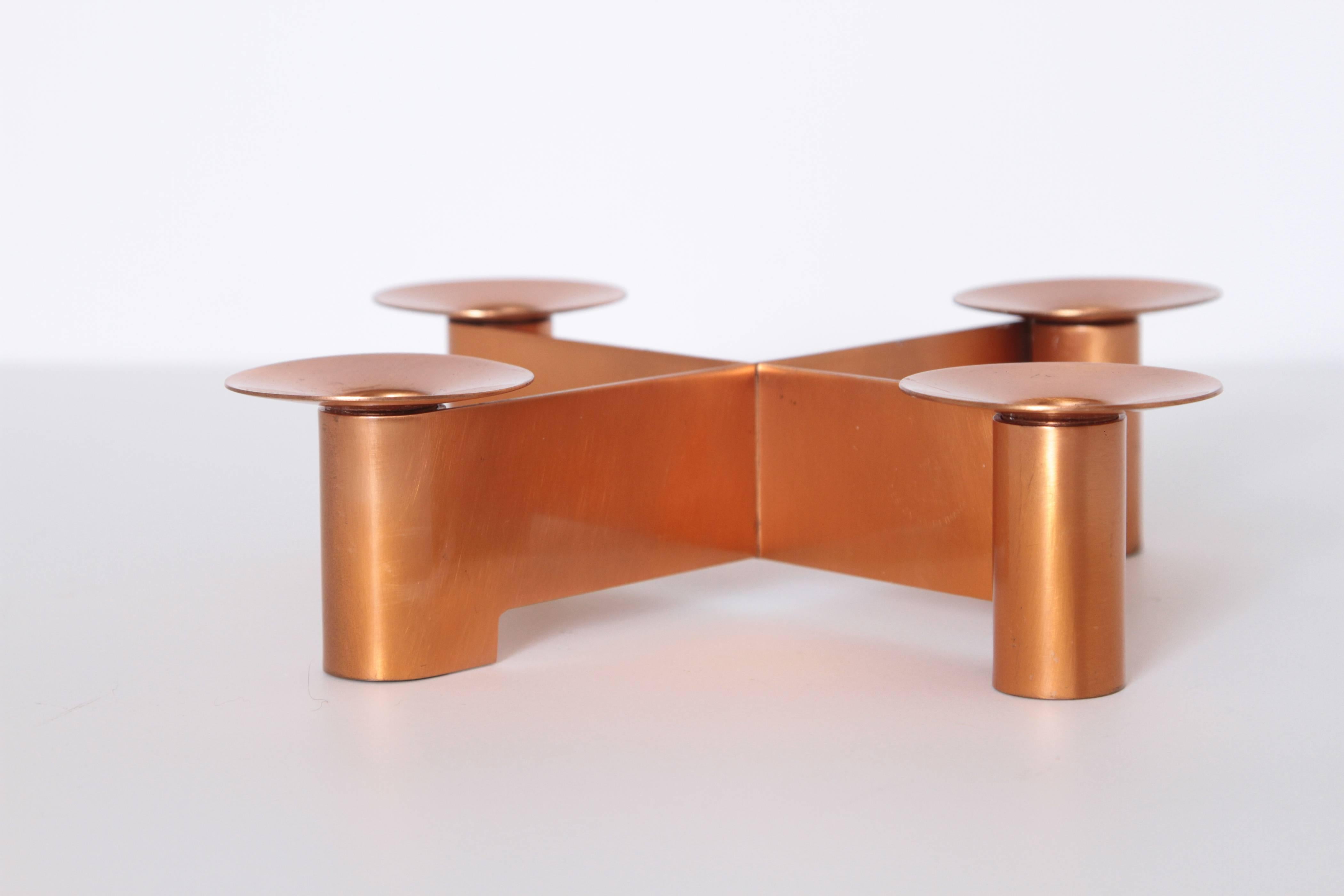 Machine Age Art Deco Albert Reimann candlepiece for Chase in satin copper, 1933

Signed Dr. Reimann designs are scarce for Chase, as well as for his own studio in Germany.
Candlepiece introduced prior to 1933 and featured in only 1933