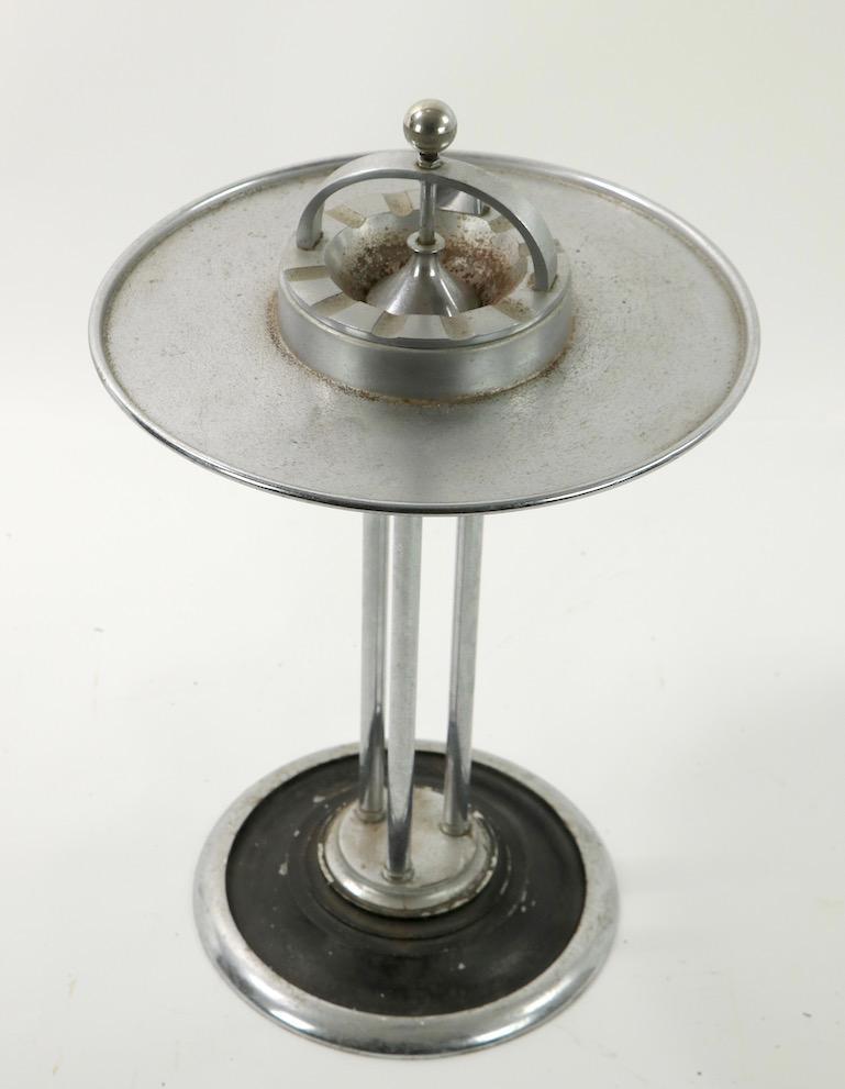 Iconic standing ashtray stand designed by W.J. Campbell for Climax. Made for use on a train, it is extremely heavy to prevent tipping or falling over. The circular tray surface is removable to sever your favorite cocktail, while enjoying a smoke.