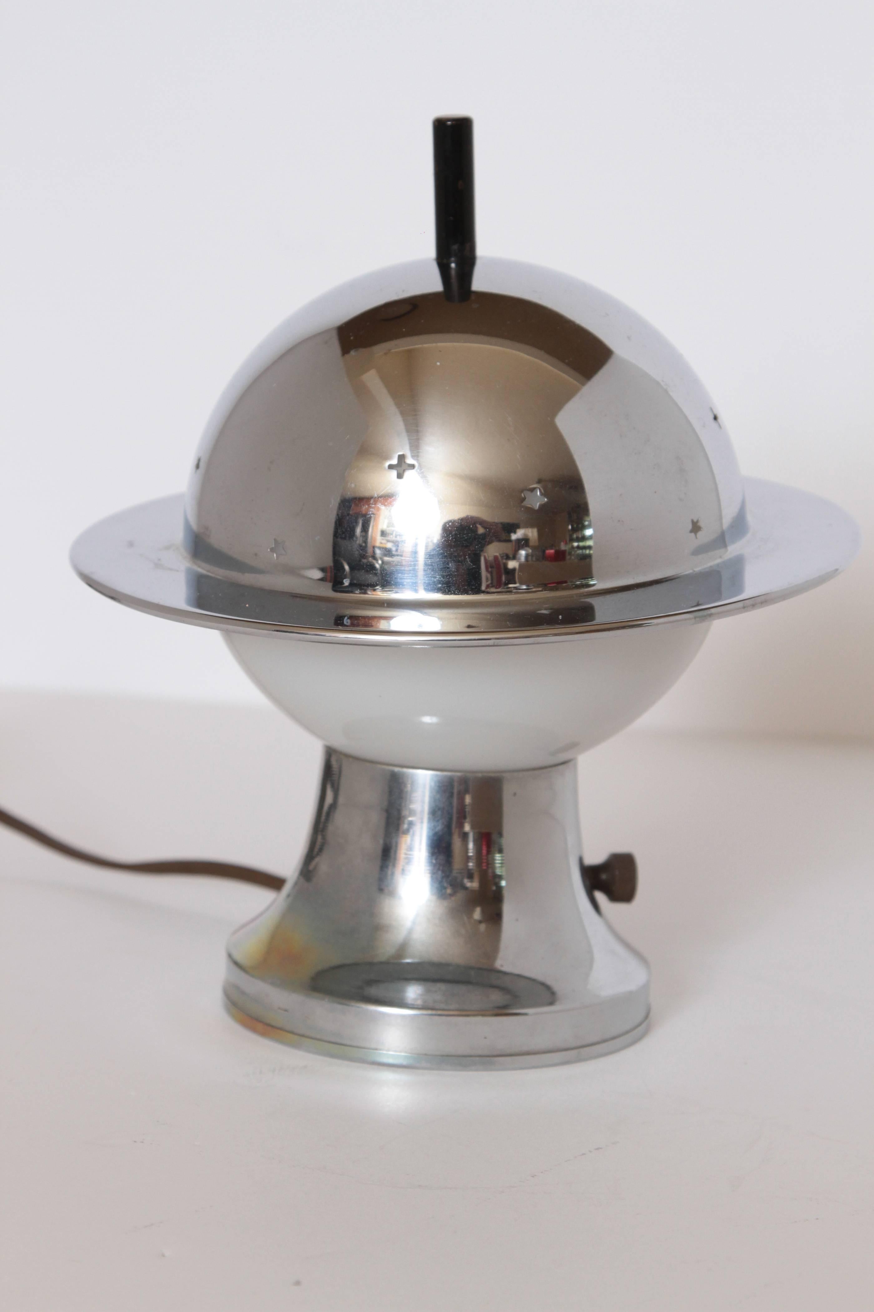 Machine Age Art Deco Chase Constellation table lamp by Walter Von Nessen in Saturn style. 

Classic original Nessen design for Chase in original polished chrome finish.
Introduced in 1934, Chase Catalog #17048.

Adjustable pierced hat shade