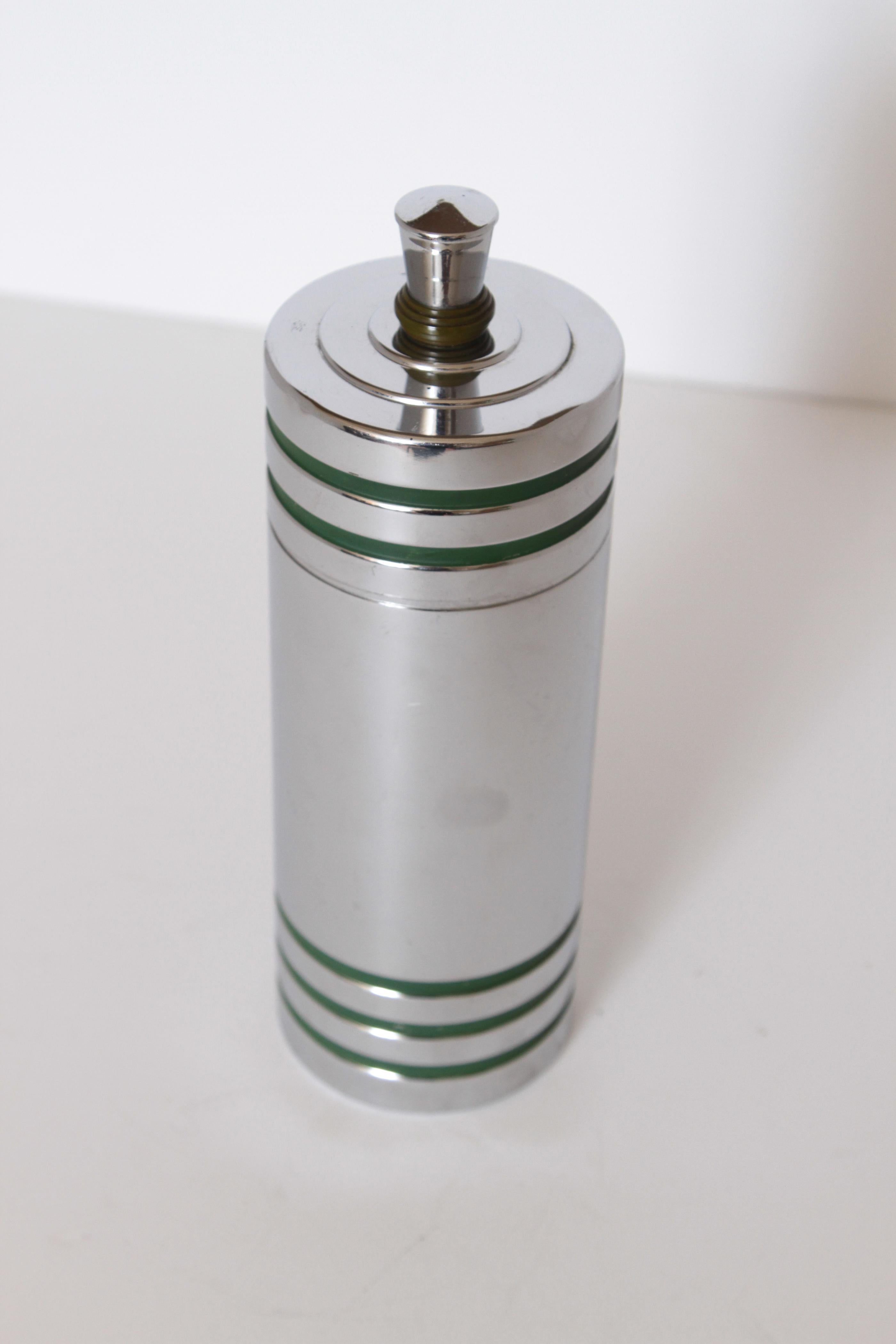 Machine Age Art Deco Chase Gaiety cocktail shaker in rare green Catalin by Howard Reichenbach.

Debuting in 1934, and continuing until at least 1942, the Gaiety shaker (cat # 90034) was undoubtedly one of Chase's most popular items. Truly great