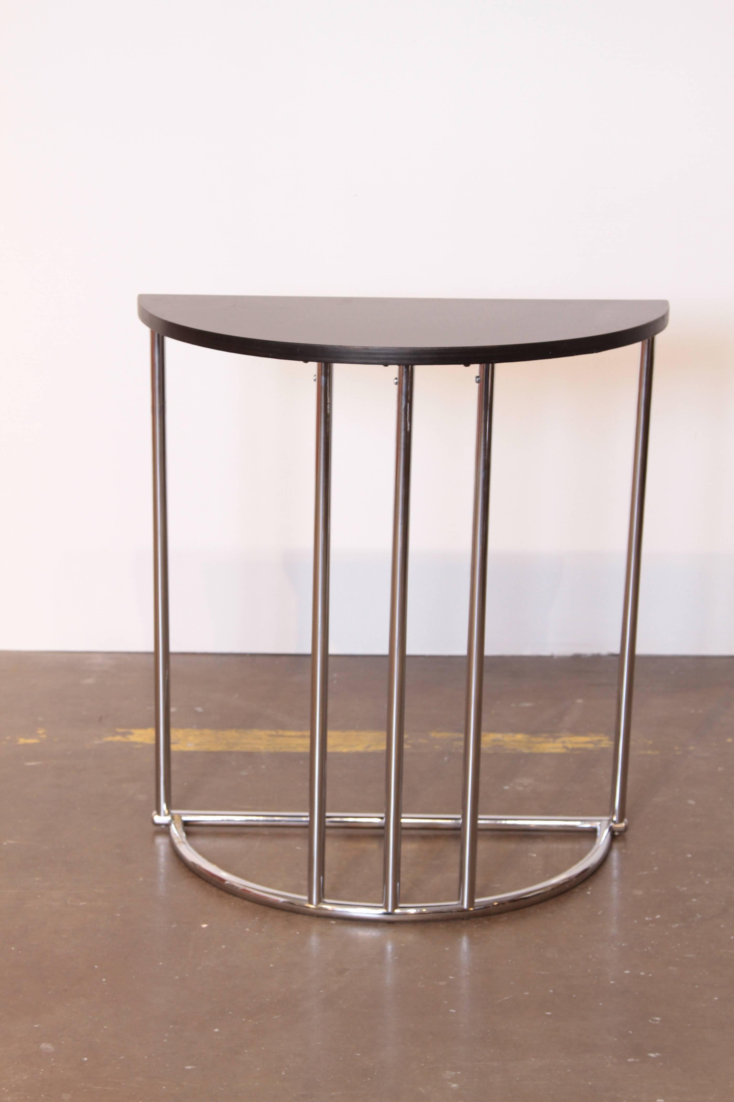 Machine Age Art Deco Demilune Console Table, Royalchrome Distinctive Furniture, Royal Metal

This one is built like a tank and in near pristine restored condition.
Royalchrome Distinctive Furniture, Royal Metal 1937 Catalog, Model No. 340 End Table.