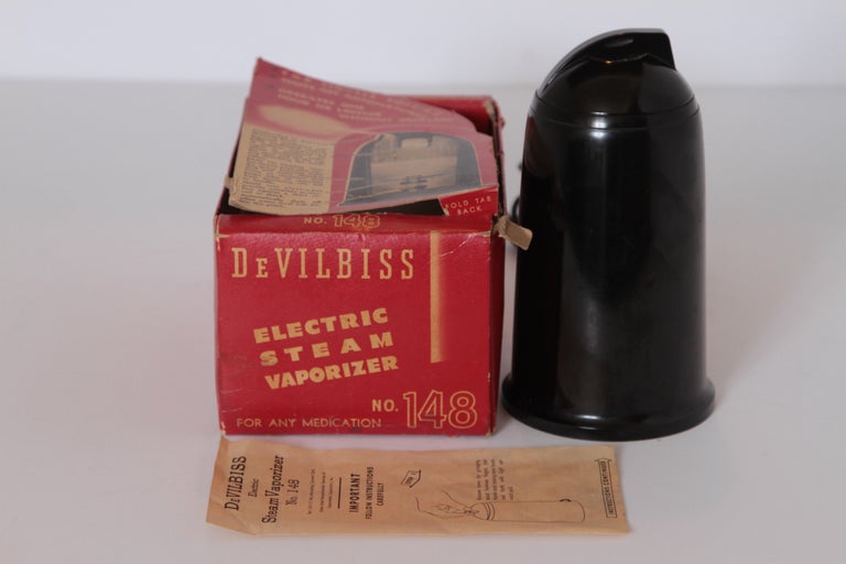 Machine Age Art Deco Industrial Streamline Design DeVilbis Electric Steam Vaporizer Bakelite Patented Design

Another original Machine Age sculptural design you will rarely find in this condition with original box and instructions
Featured in