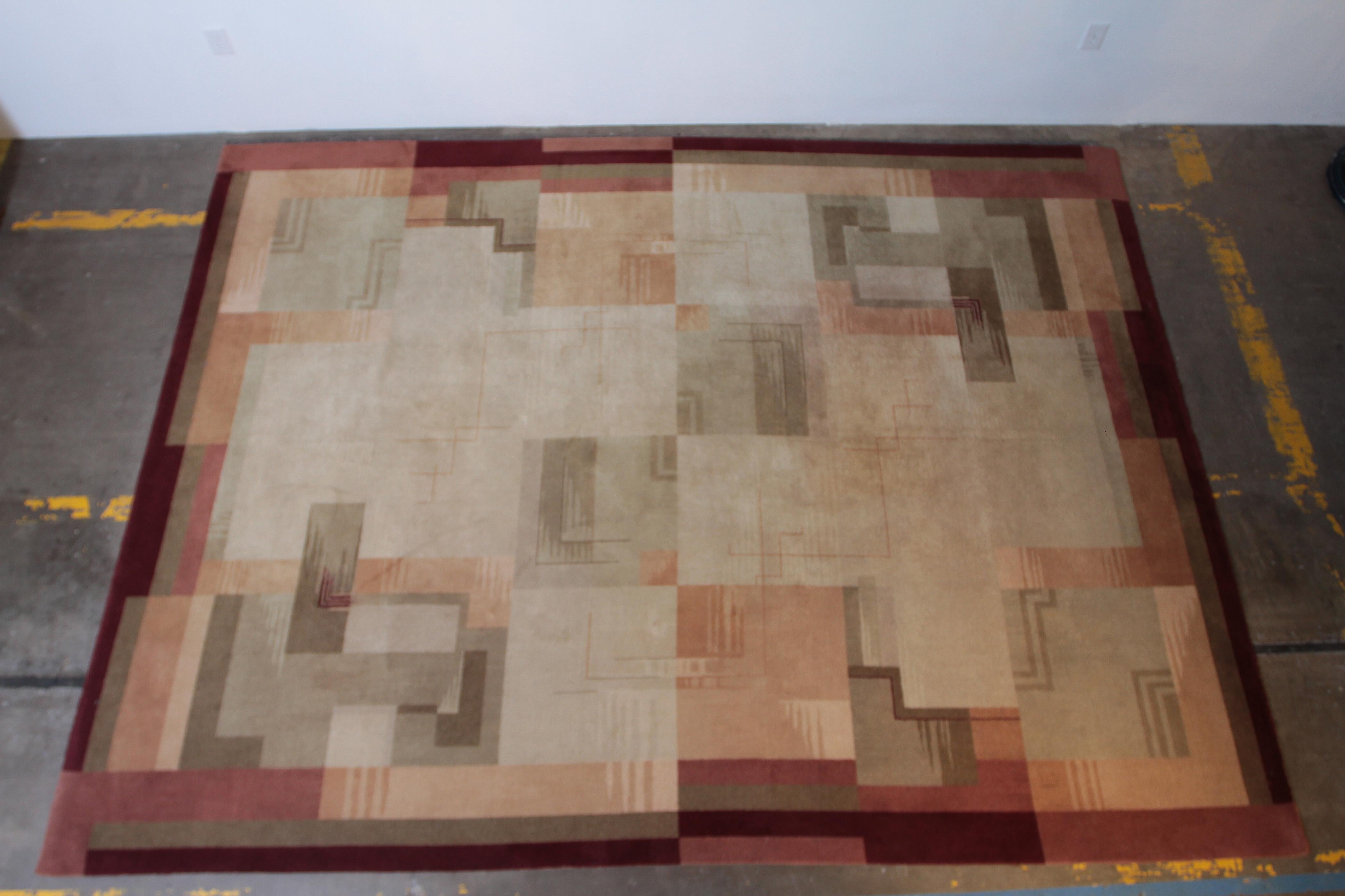 Machine age Art Deco jazz age, broadloom geometric carpet rug.

Nice original large example with good color and skyscraper geometric pattern.
Full 9' X 12' size.
Signed twice in border.
No significant issues, other than minor scattered soiling