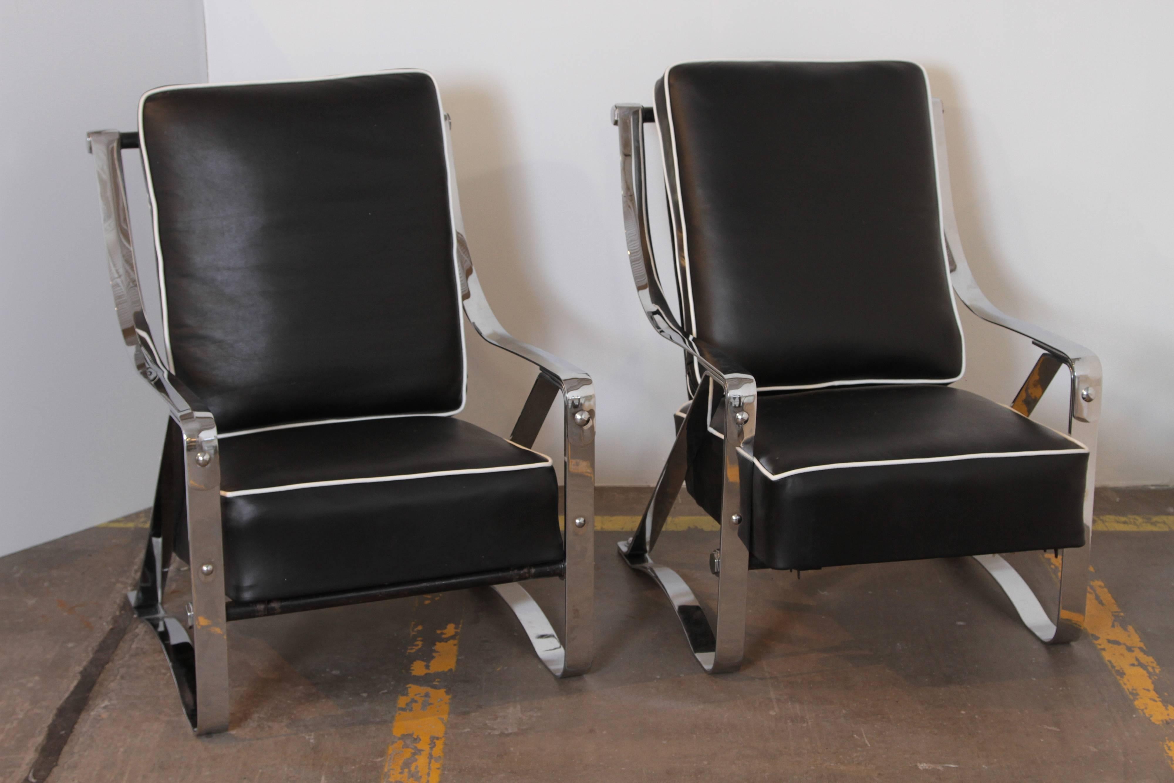 Machine Age Art Deco McKay Craft streamline pair of cantilevered lounge chairs.  PRICE REDUCED

Fully-restored condition.
Re-plated polished chrome original steel frames, new black hide leather sling and cushions with white leather piping. 
Re-tied
