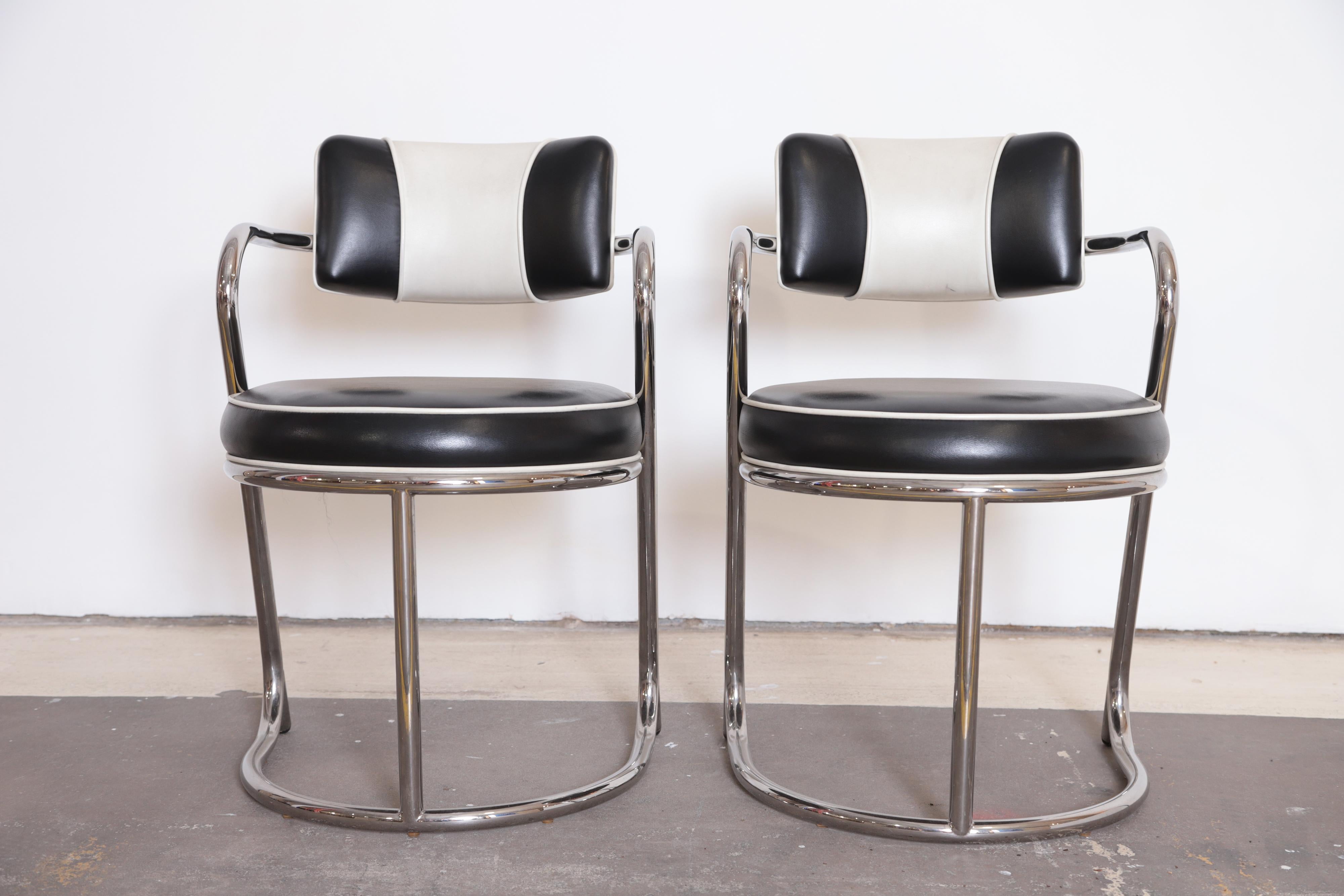Machine Age Art Deco JAZZ armchairs manner of Donald Deskey for Royalchrome.

Pair of 1980s Art Deco Revival club chairs by JAZZ.
Tubular chrome and leatherette. 

These are very well-built.
 