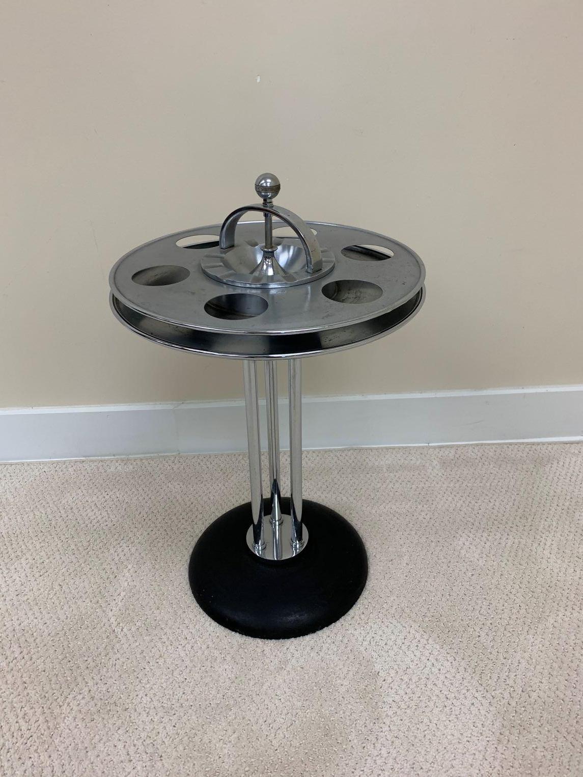 Rare Art Deco railroad drink and smoking stand. This piece would have been found in the lounge cars of most railroad companies of the 1930’s. Including Union Pacific and Northern Pacific. Unique piece with six drink receptacles with the ashtray