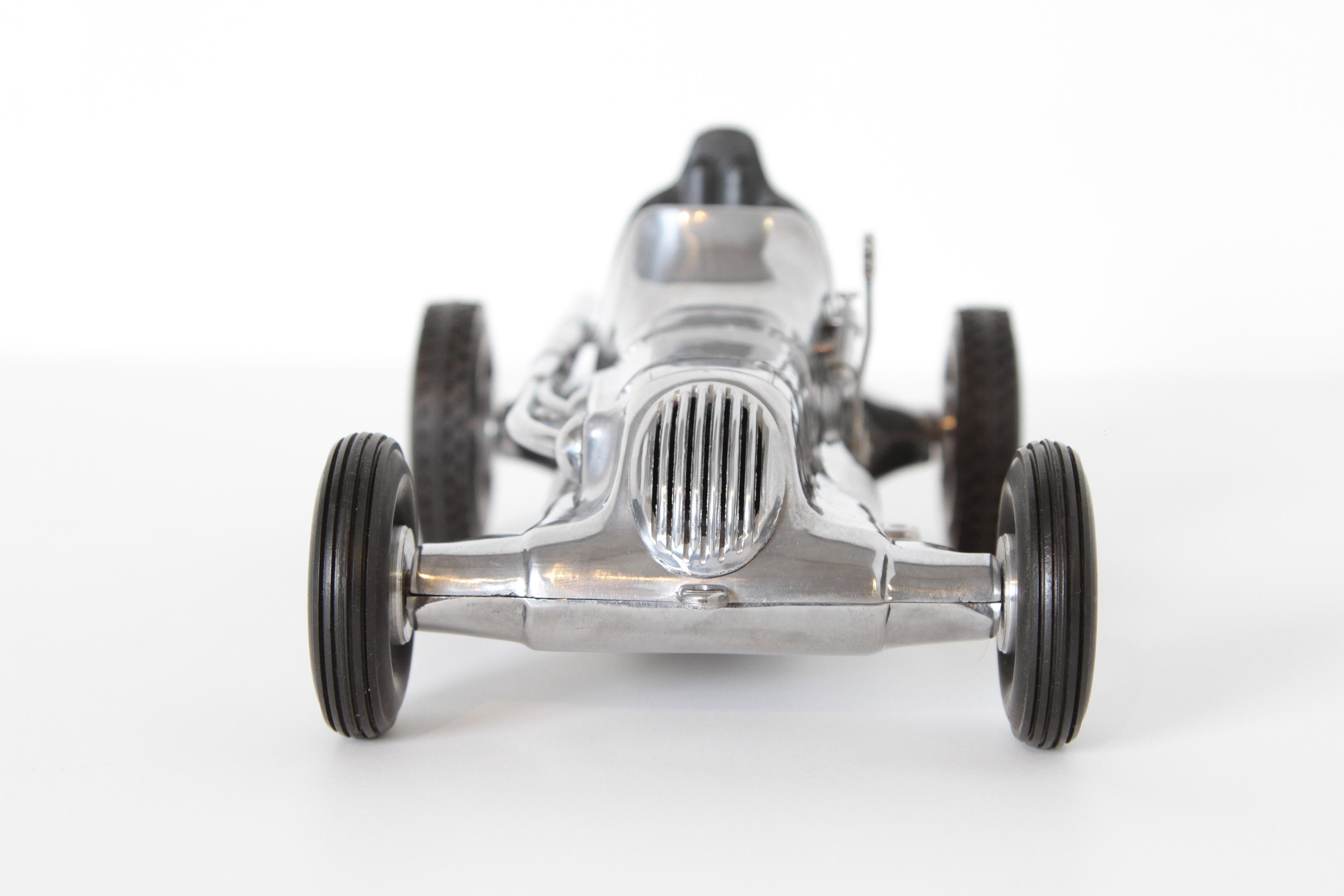 Mid-20th Century Machine Age Art Deco Roy Cox Thimbledrome Polished Aluminium Tether / Push Car For Sale
