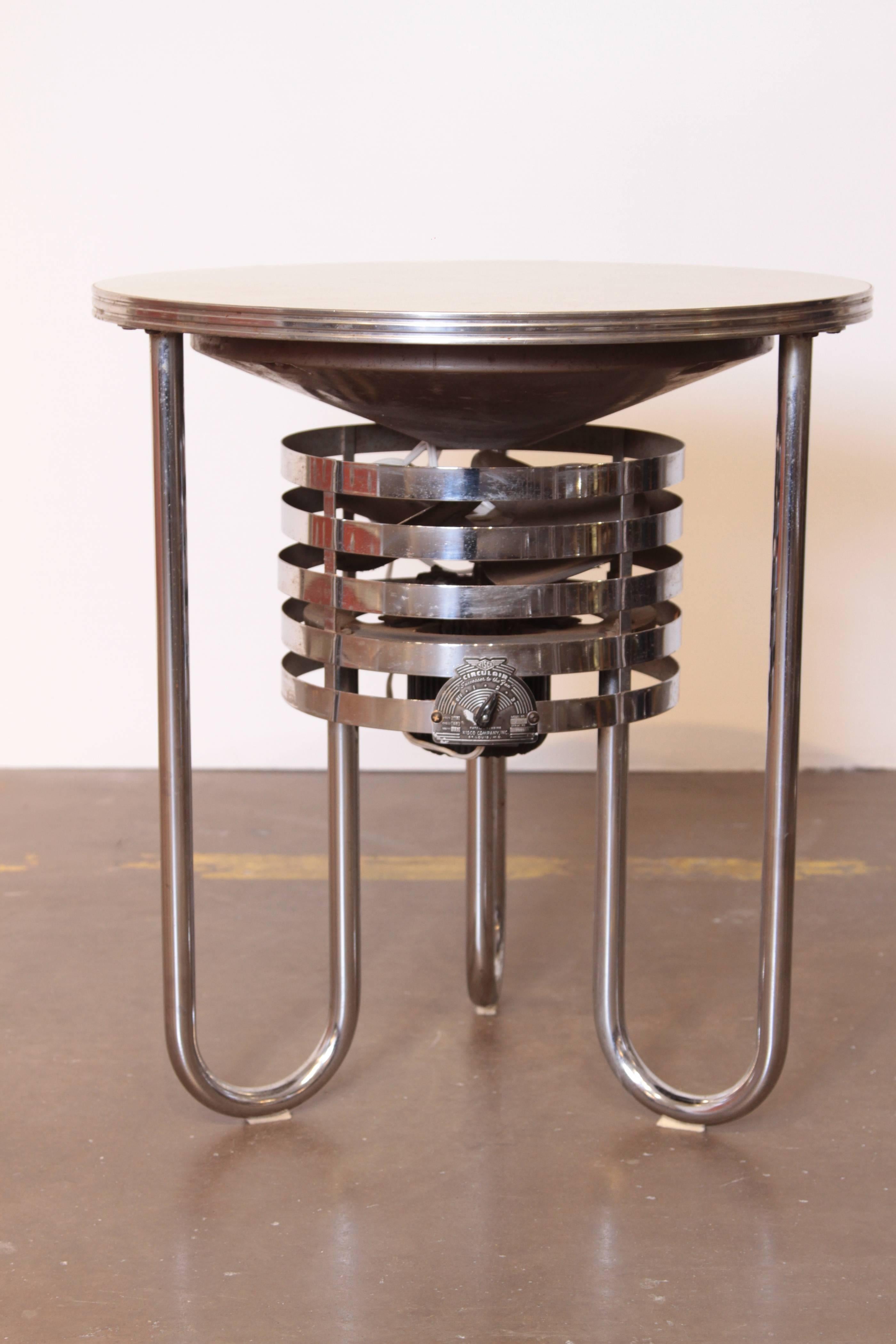 Machine Age Art Deco royal chrome fan table royal metal and Kisco fan company royal chrome. 
Classic streamline bent-tube design, original wheat Formica top and chrome. 

Fan is restored. Kisco circulair three-speed model.
Chrome and top
