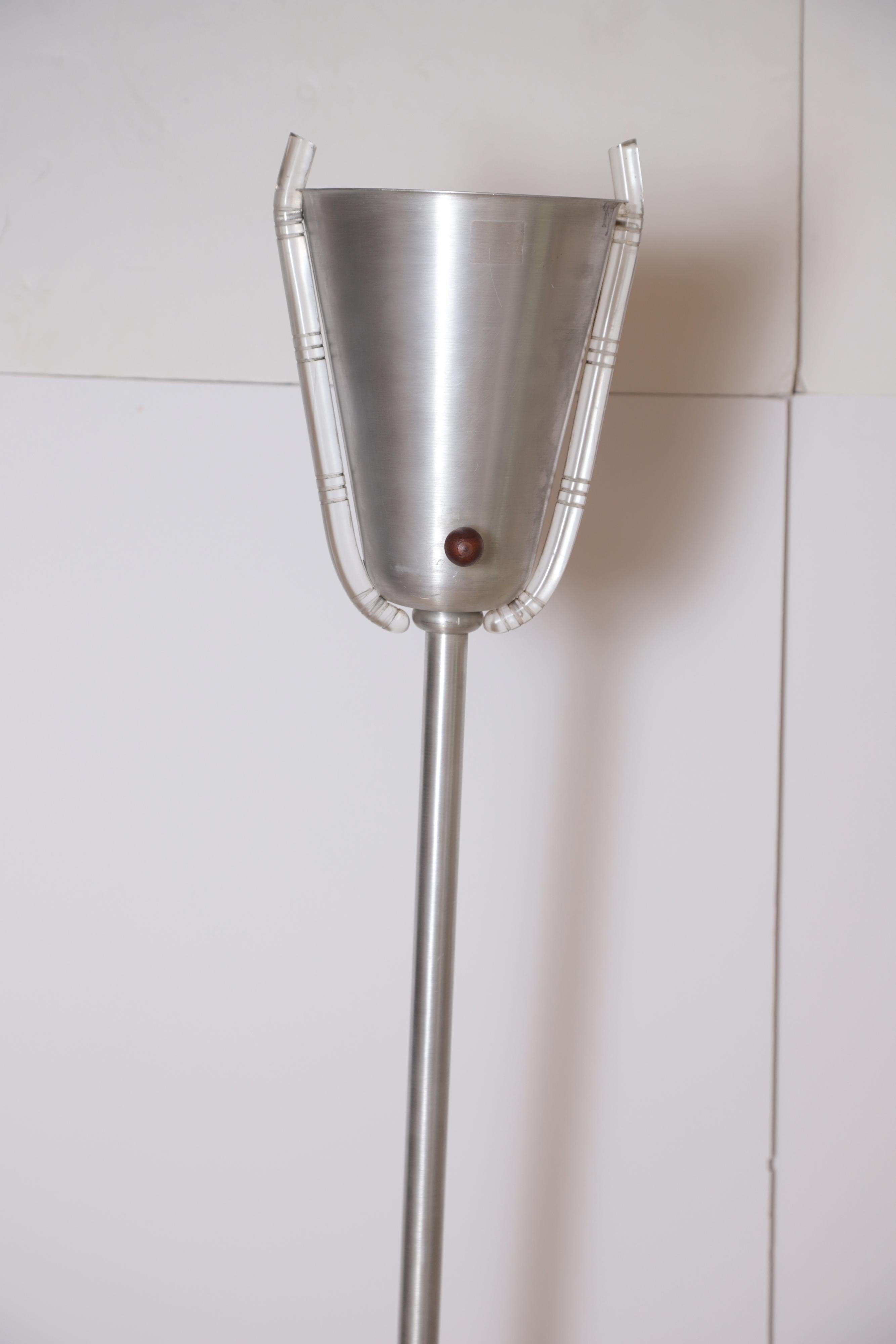 Machine age Art Deco Russel Wright spun aluminum Torchiere Torchierre Lucite Russell Wright up light floor lamp

Uncommon Classic banded Lucite shade ornamentation, difficult to source in this condition. Original wood switch knob.
Impressed
