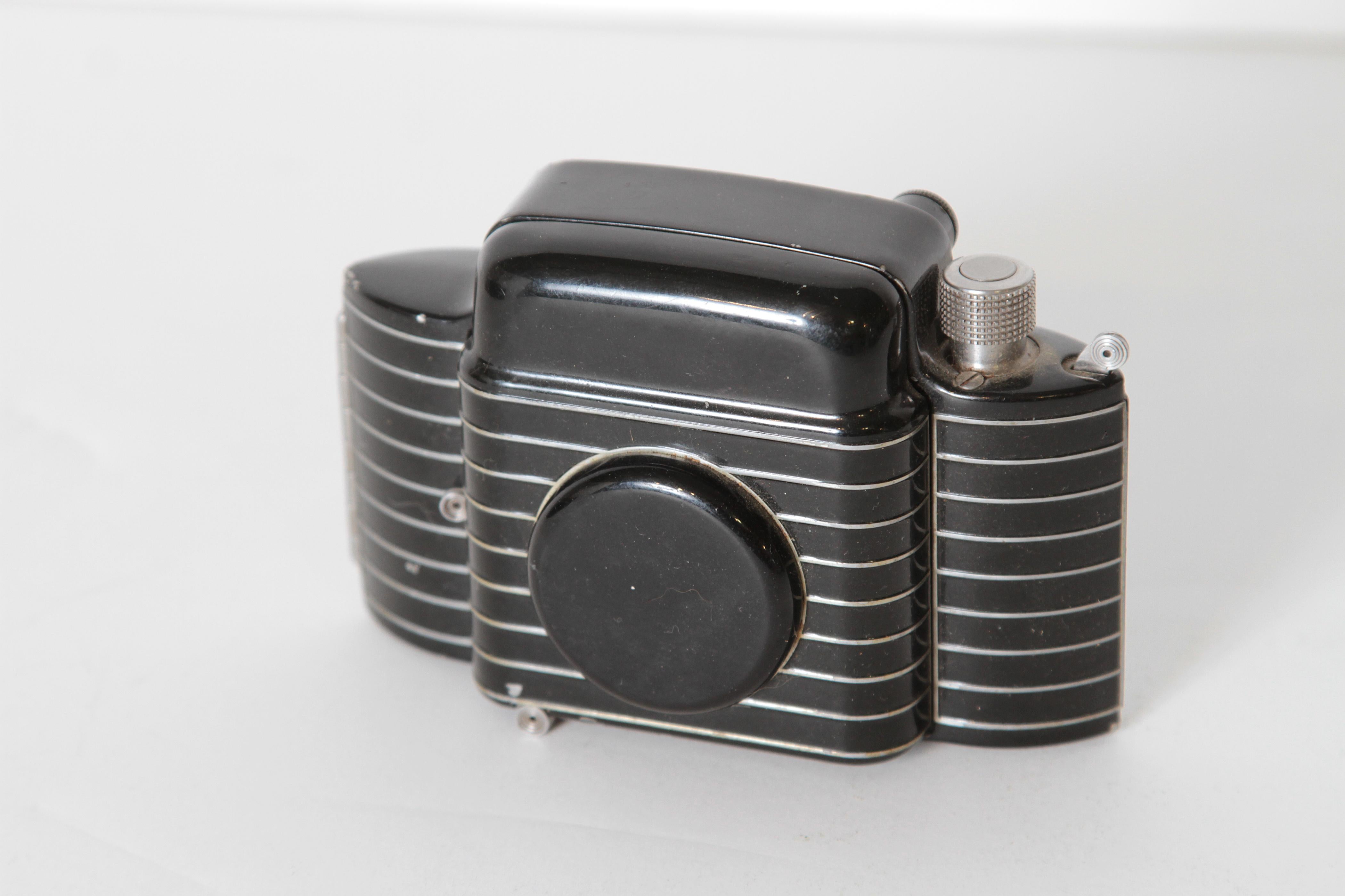 Machine Age Art Deco Streamline Walter Dorwin Teague Kodak Bantam Special Camera 

Clean original untouched version of this Iconic camera. 
Introduced in 1936.
The Special's clam shell styling enabled it to become a truly pocketable, and practical