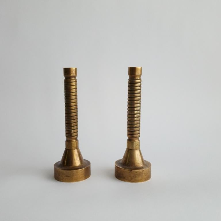 Pair of Mid 20th century patinaed candlesticks
Machine turned solid bronze
c. 1940s

Measurements:
8-1/8' H x 2-5/8