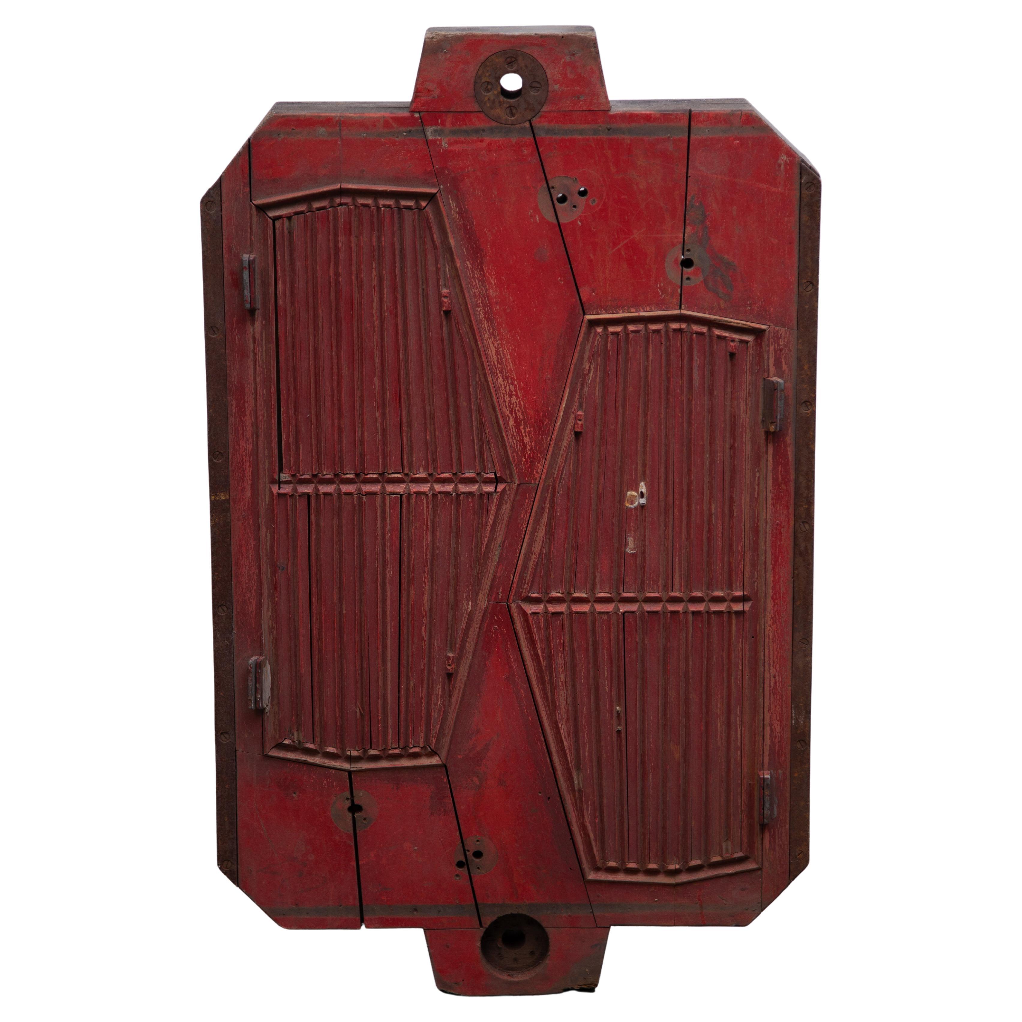 Architectural wooden foundry mold for the industrial car industry in the 50s, now a decorative machine age object for a modern interior.

Foundry molds and patterns are wooden tools, cut or built up to create negative space, which in turn is used to