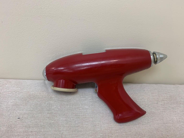Machine Age streamline Art Deco ice gun by OPCO of Los Angeles.
Unbelievably rare - Opco Company, the Ice Gun USA, circa 1935 enameled aluminum, chrome-plated steel, rubber
Measures: 11 W x 2.75 D x 6.75 H inches
Signed with printed mark to top: