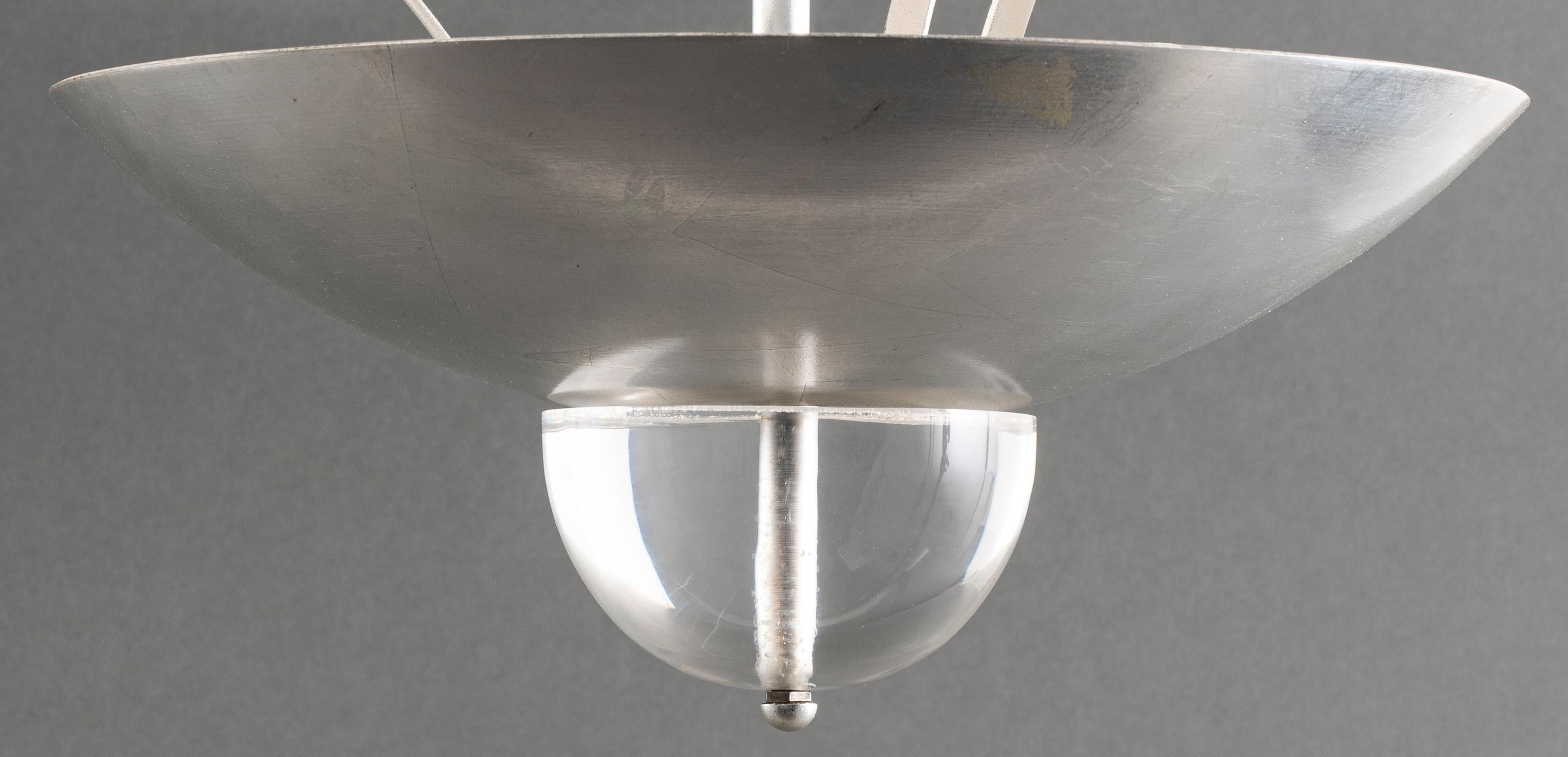 Machine Age style silver-tone five-light tiered chandelier with lucite sphere details. Measures: 34” height x 24” diameter.
