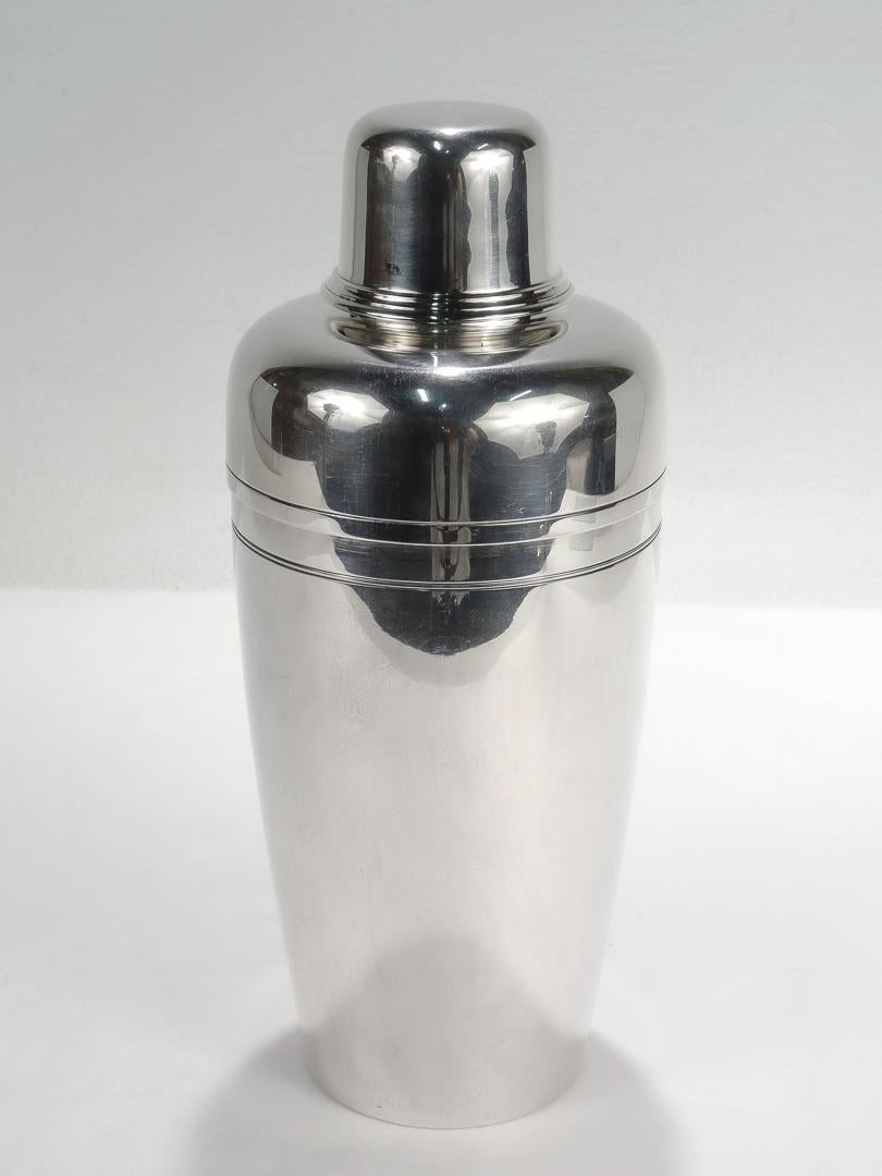 A fine Art Deco / Machine Age cocktail shaker.

By Tiffany & Co.

In sterling silver.

This streamlined model was first produced in 1937. With clean lines & a crisp profile the shaker embodies an era!

Simply top shelf barware from Tiffany &