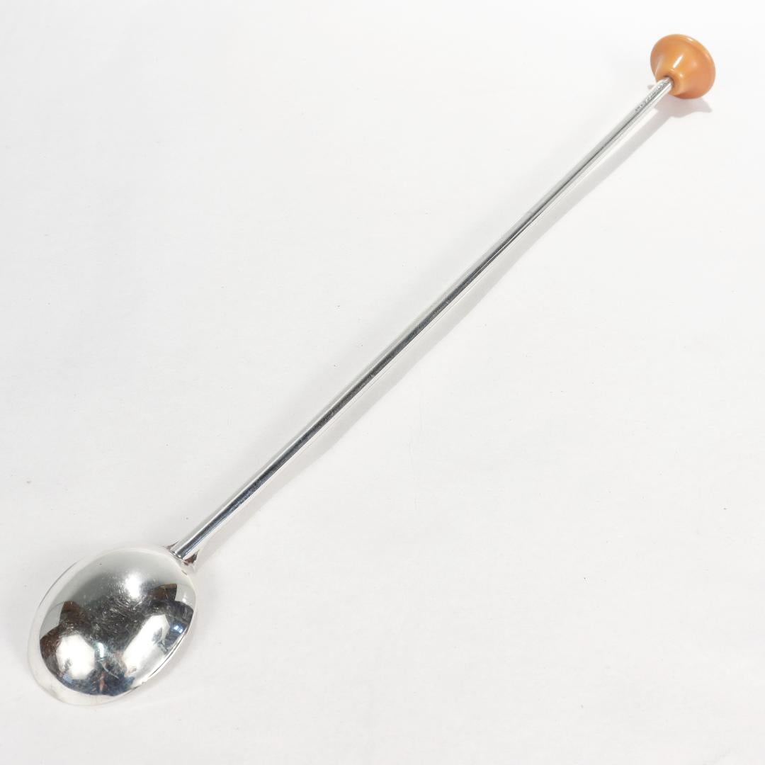 A fine cocktail spoon or stirrer.

In sterling silver.

By Watson Silver Co.

Fashioned as an elongated spoon for stirring cocktails with a bakelite finial to the handle.

Marked to the handle with a Watson Silver Co. maker's mark / Sterling /